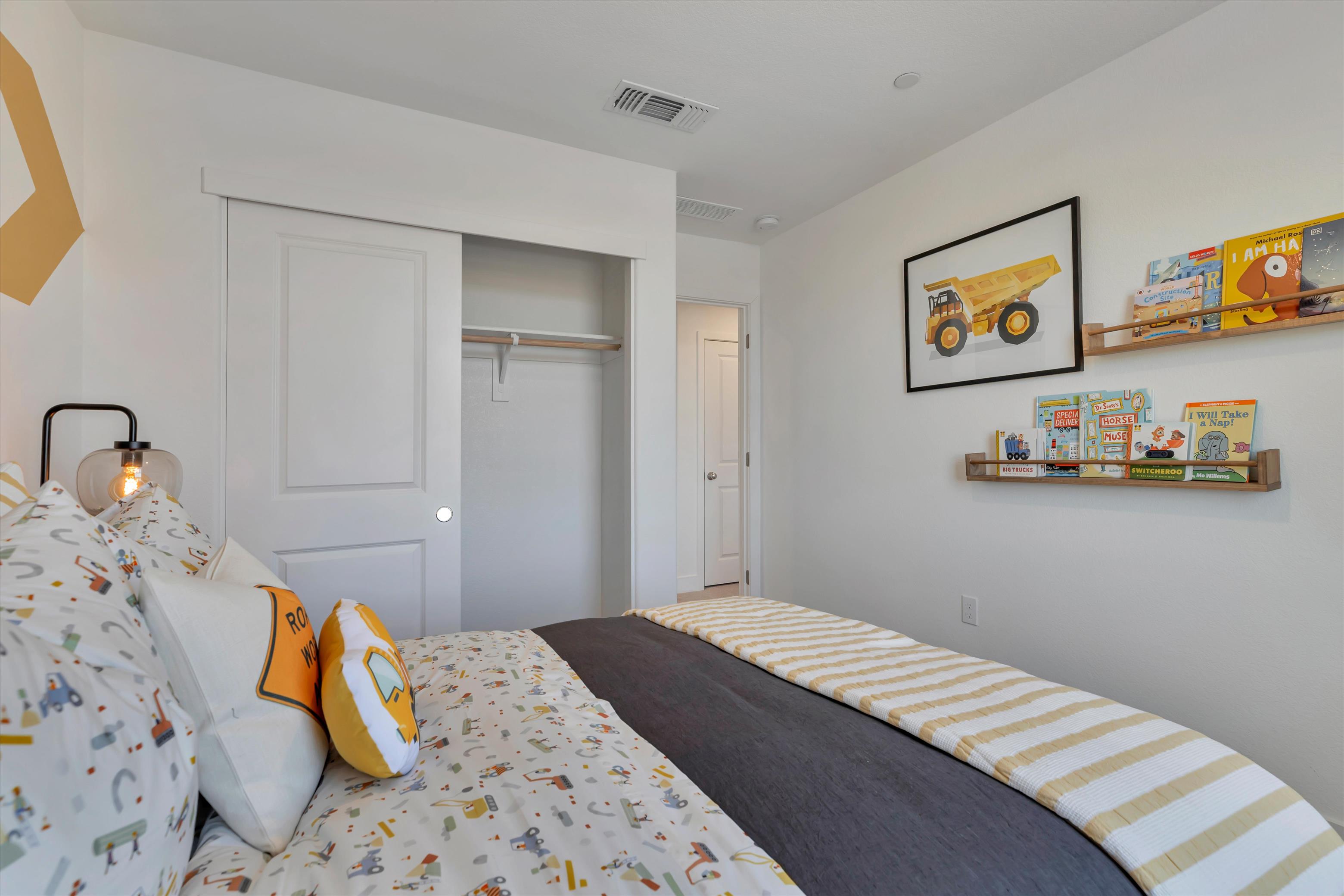 A bedroom with two beds.