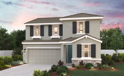 A white house with a garage.