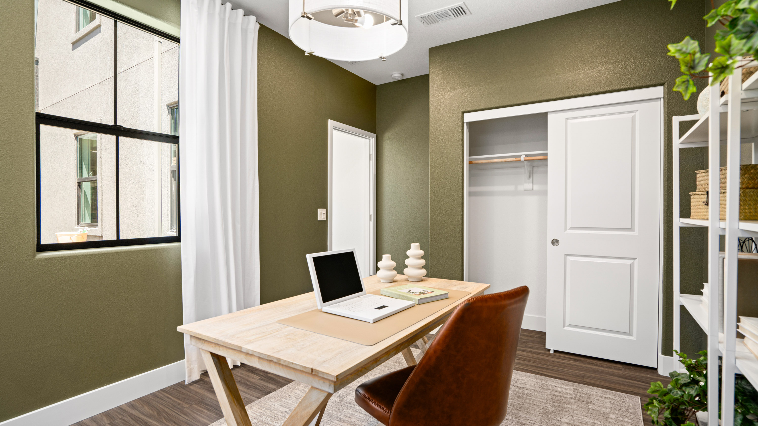 A table with a laptop on it.