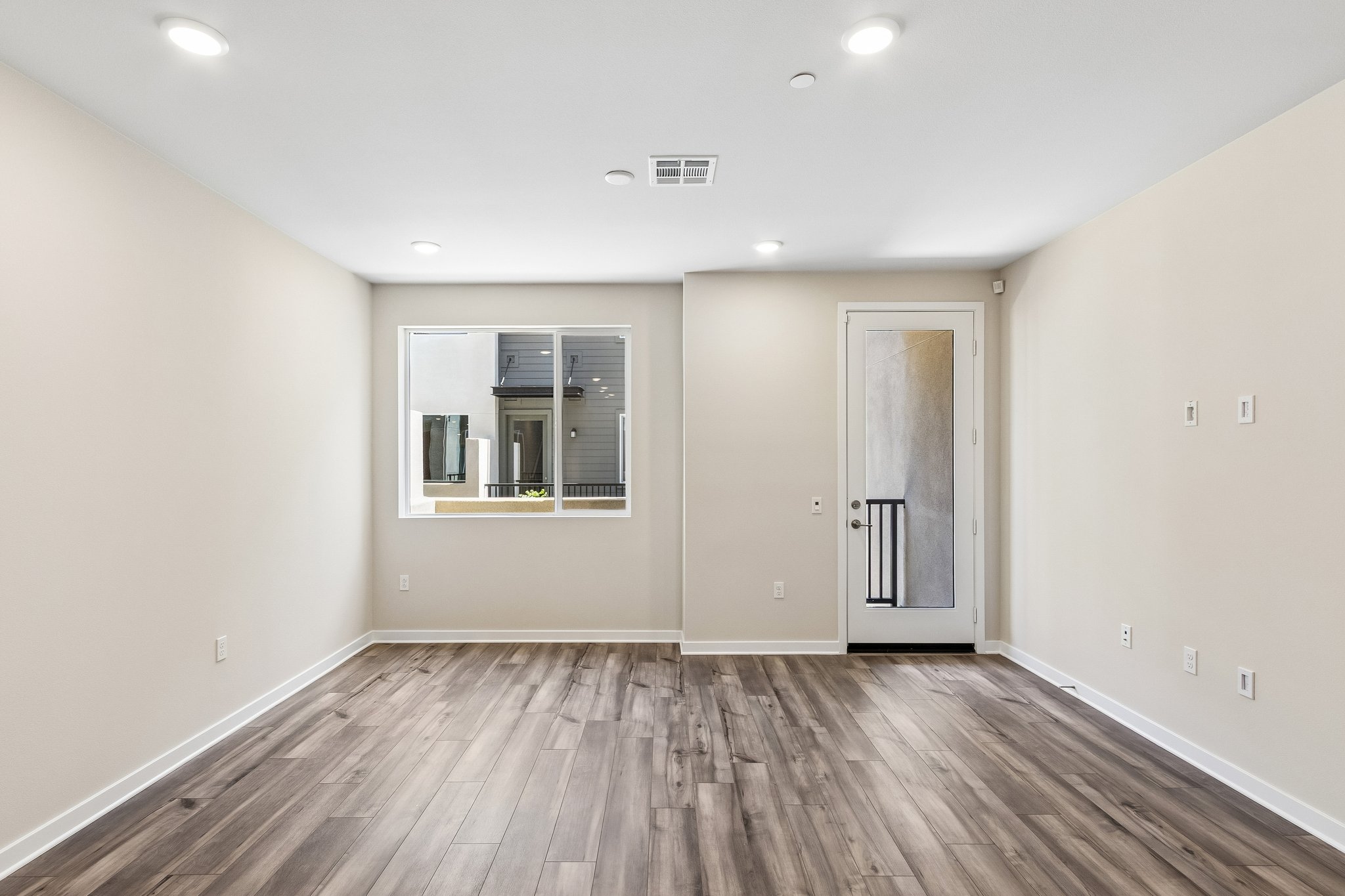 A room with a wood floor and a wood floor.