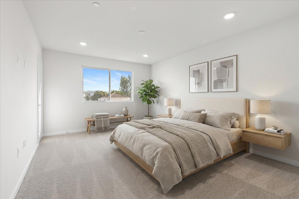 A bedroom with a bed and a desk.