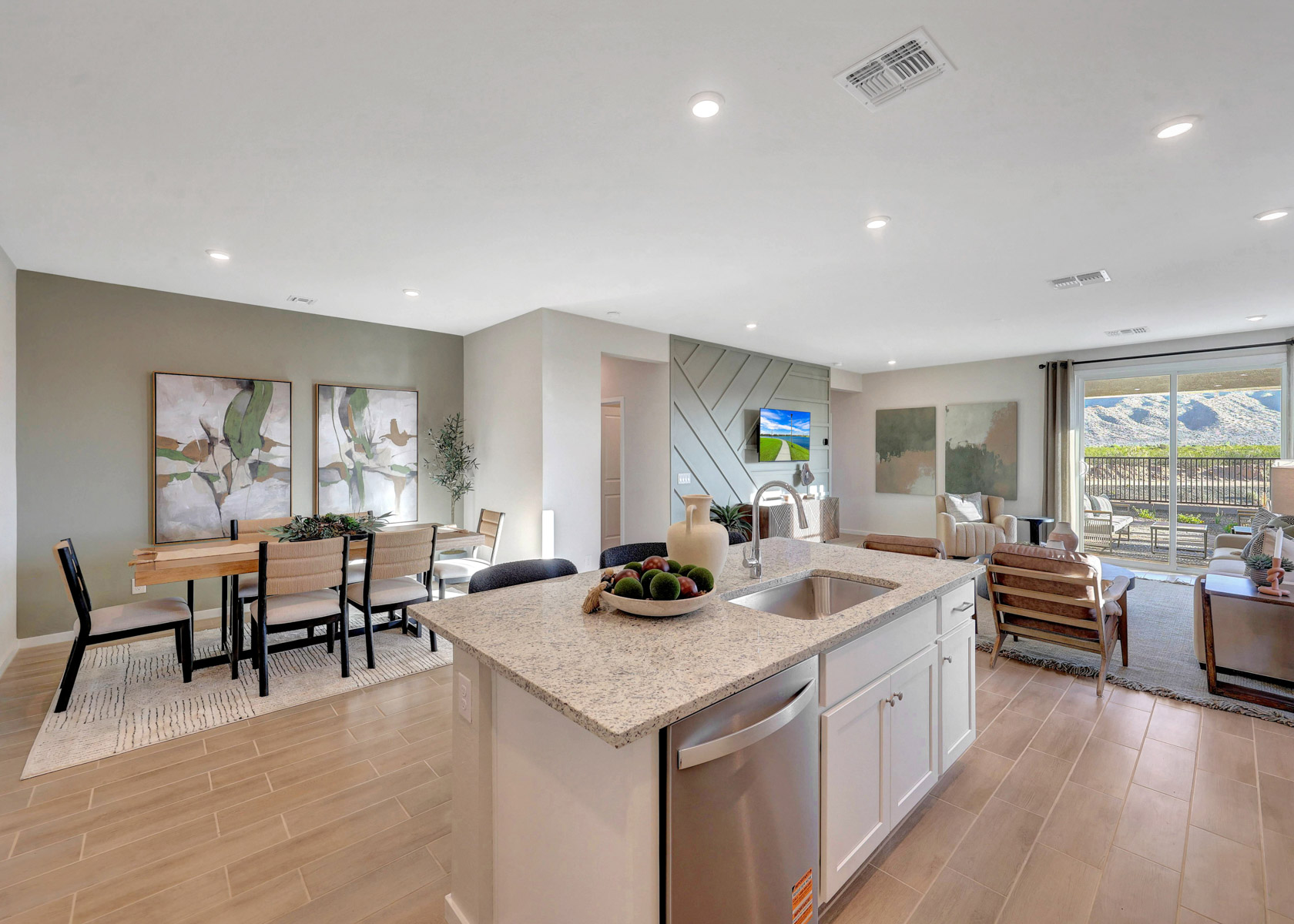 A kitchen with a marble island.