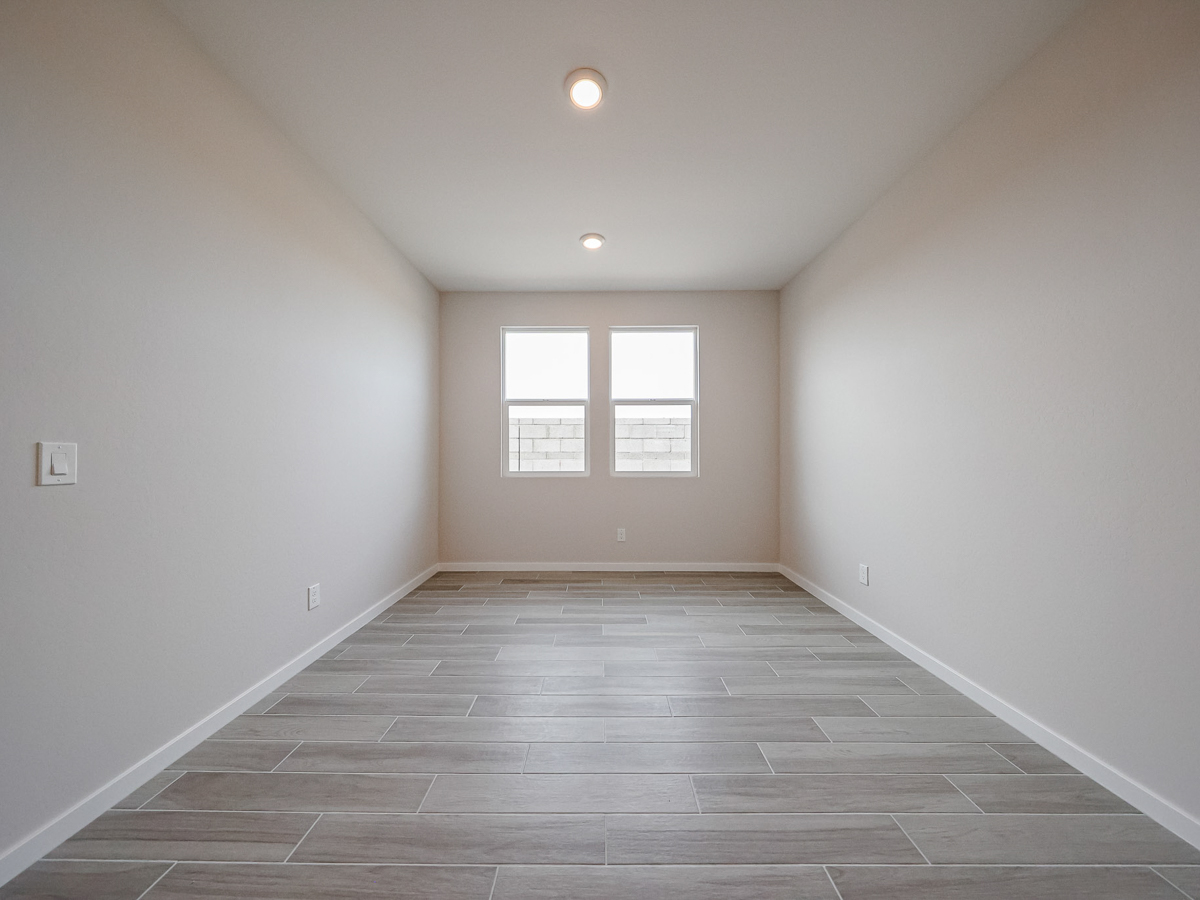 A room with a tile floor and a window.