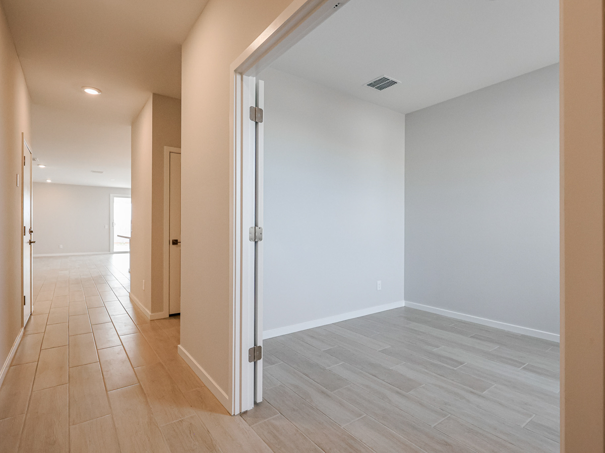 A hallway with white walls.