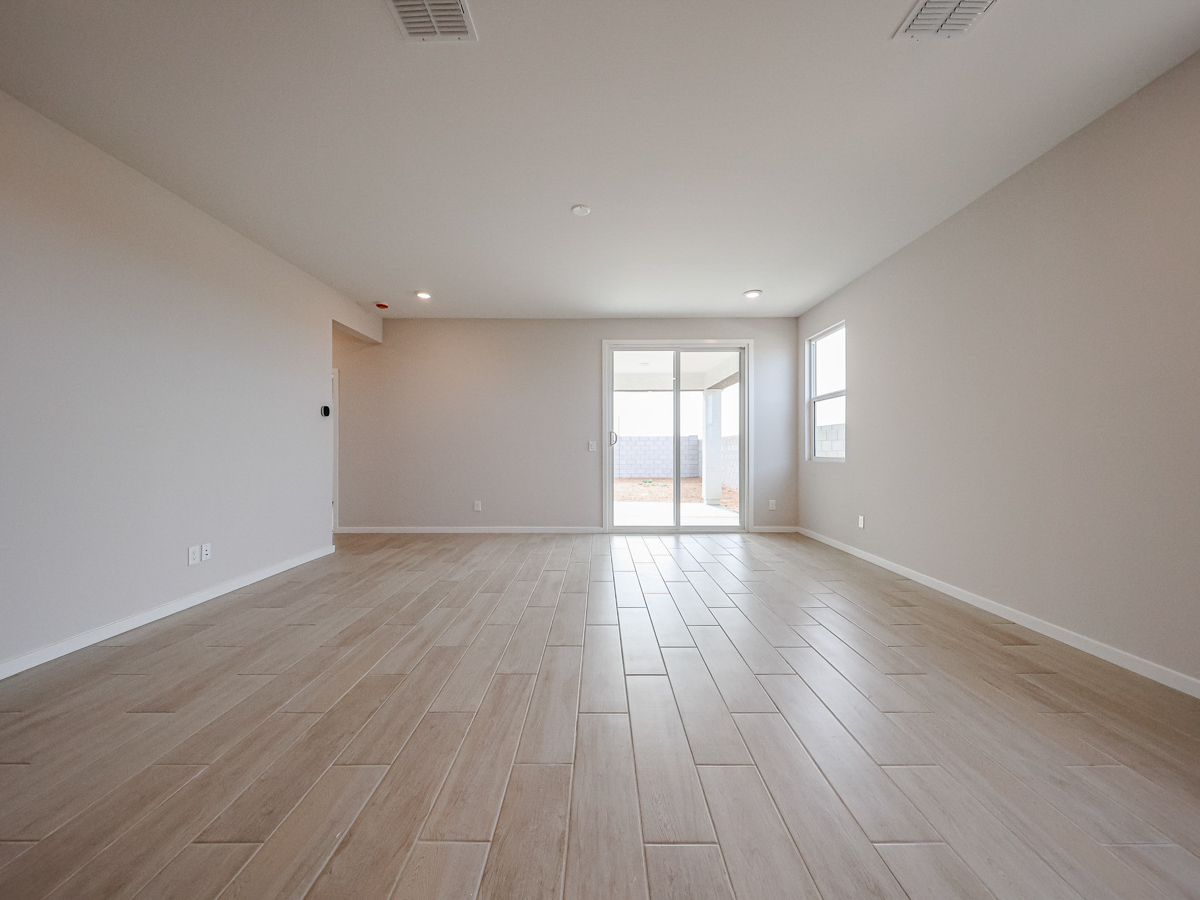 A room with a wood floor and a wood floor.