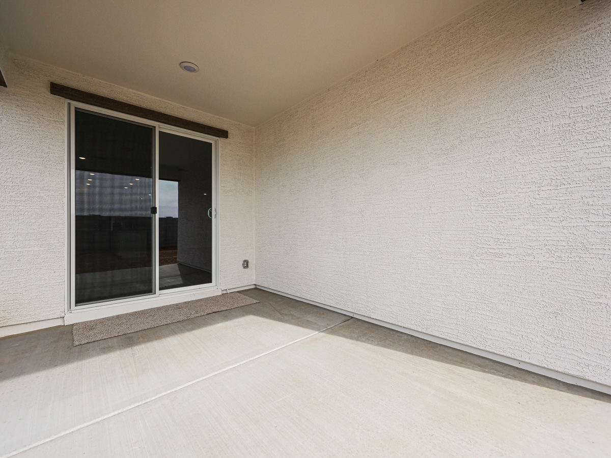 A room with a window and a door.