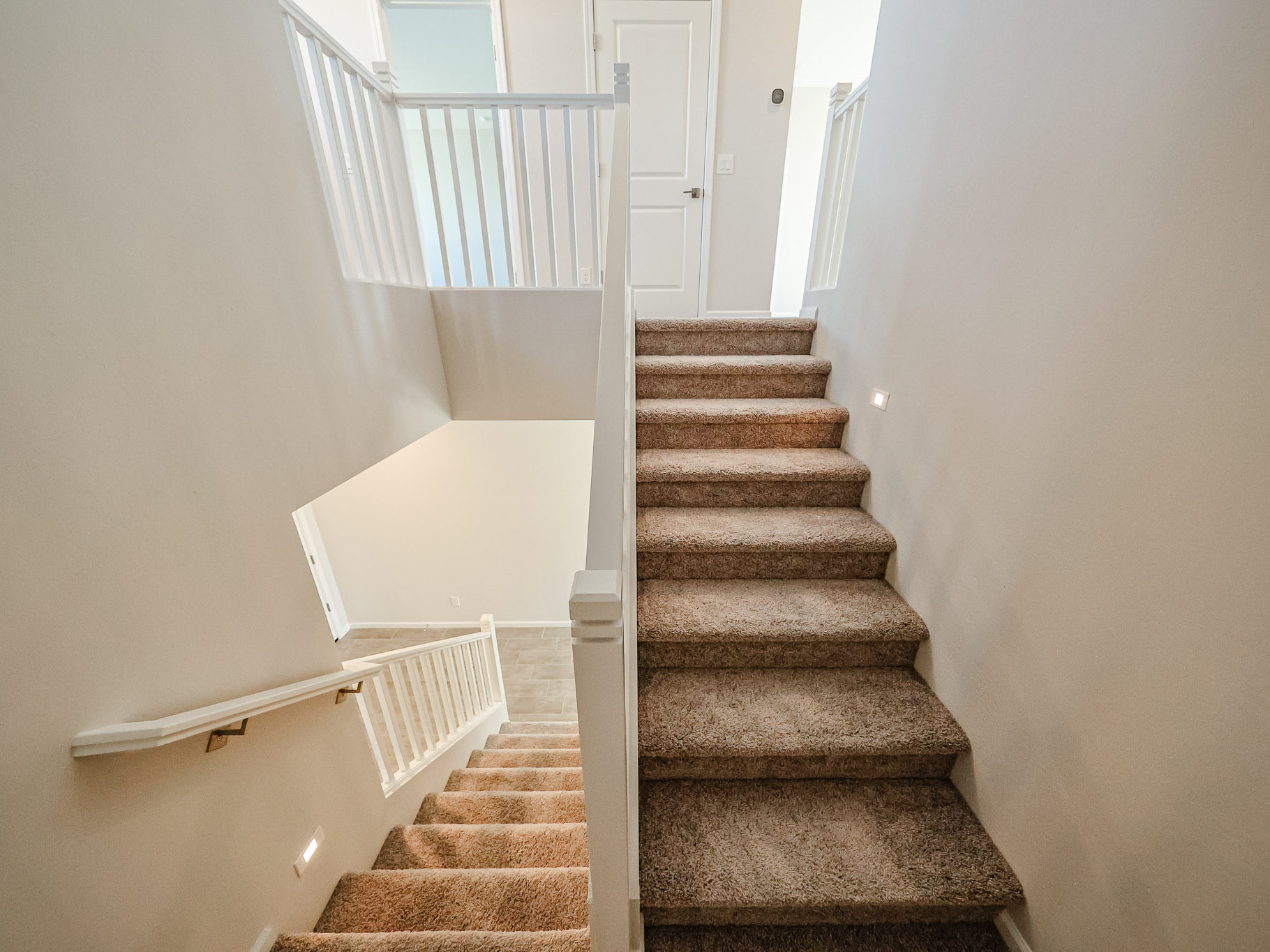 A staircase with a bathtub and a bathtub.