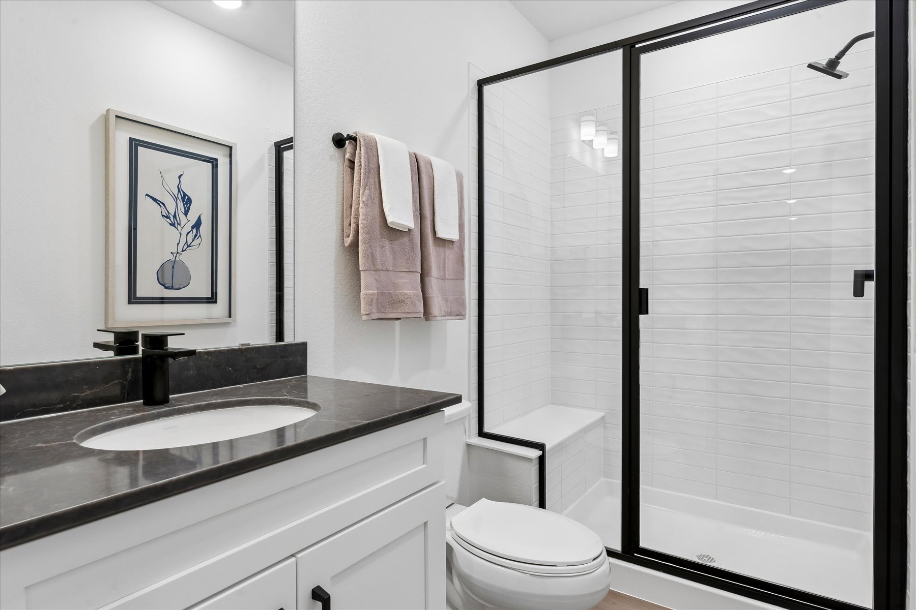 A bathroom with a glass shower.