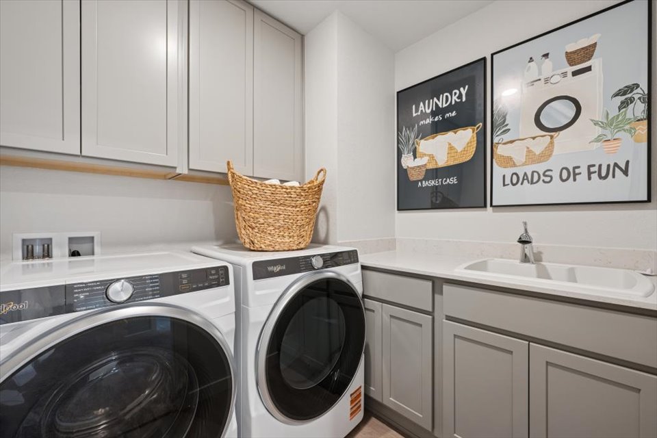 A laundry room with a washer and dryer.