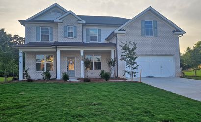 A house with a large front yard.