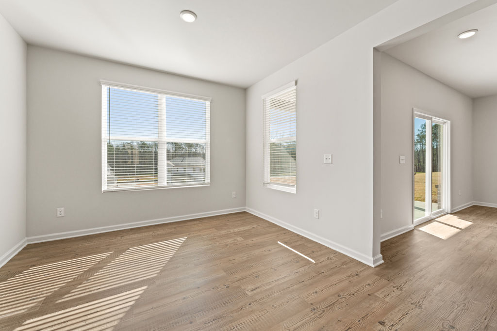 A room with a wood floor and a wood floor.