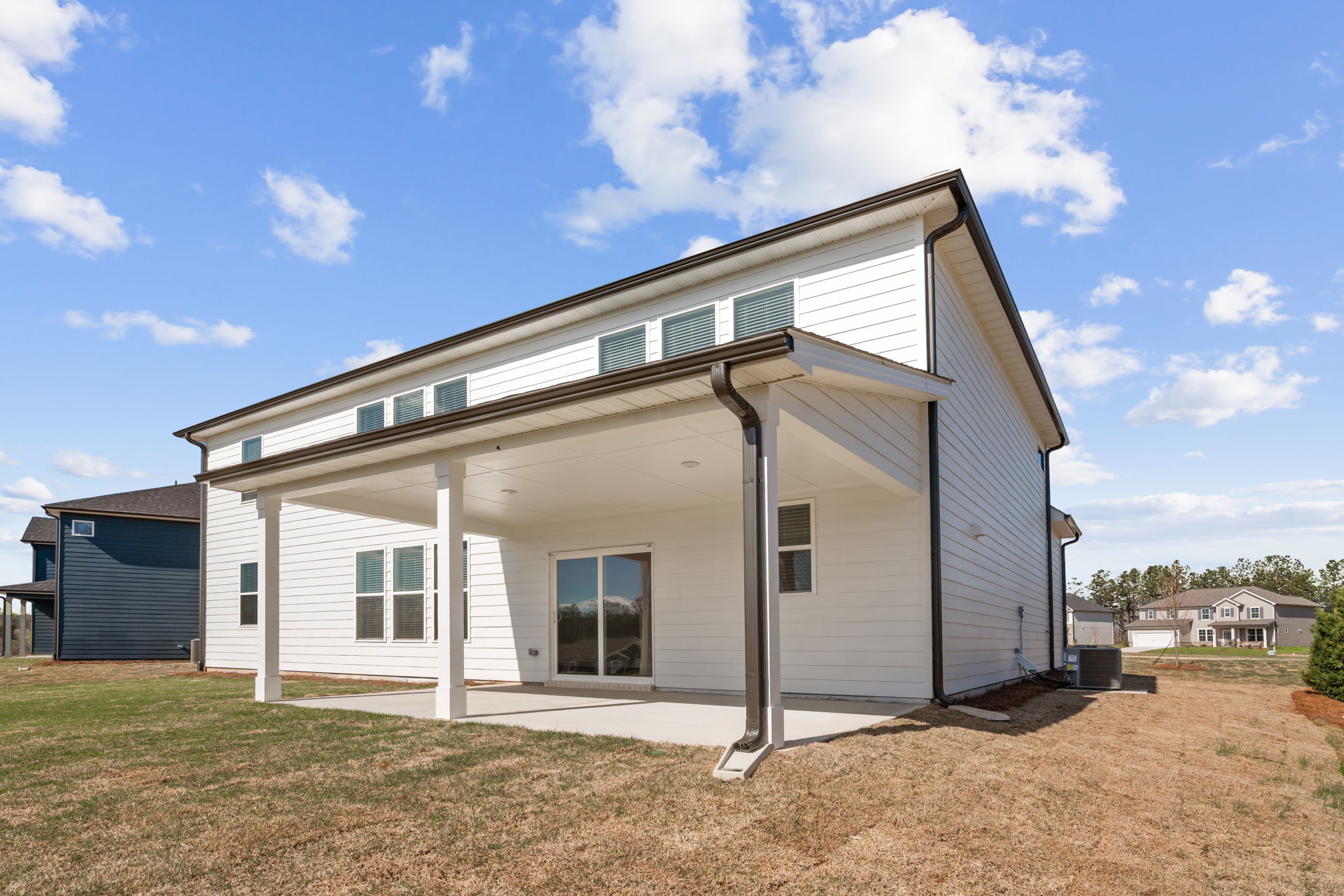 A white building with a blue sky.