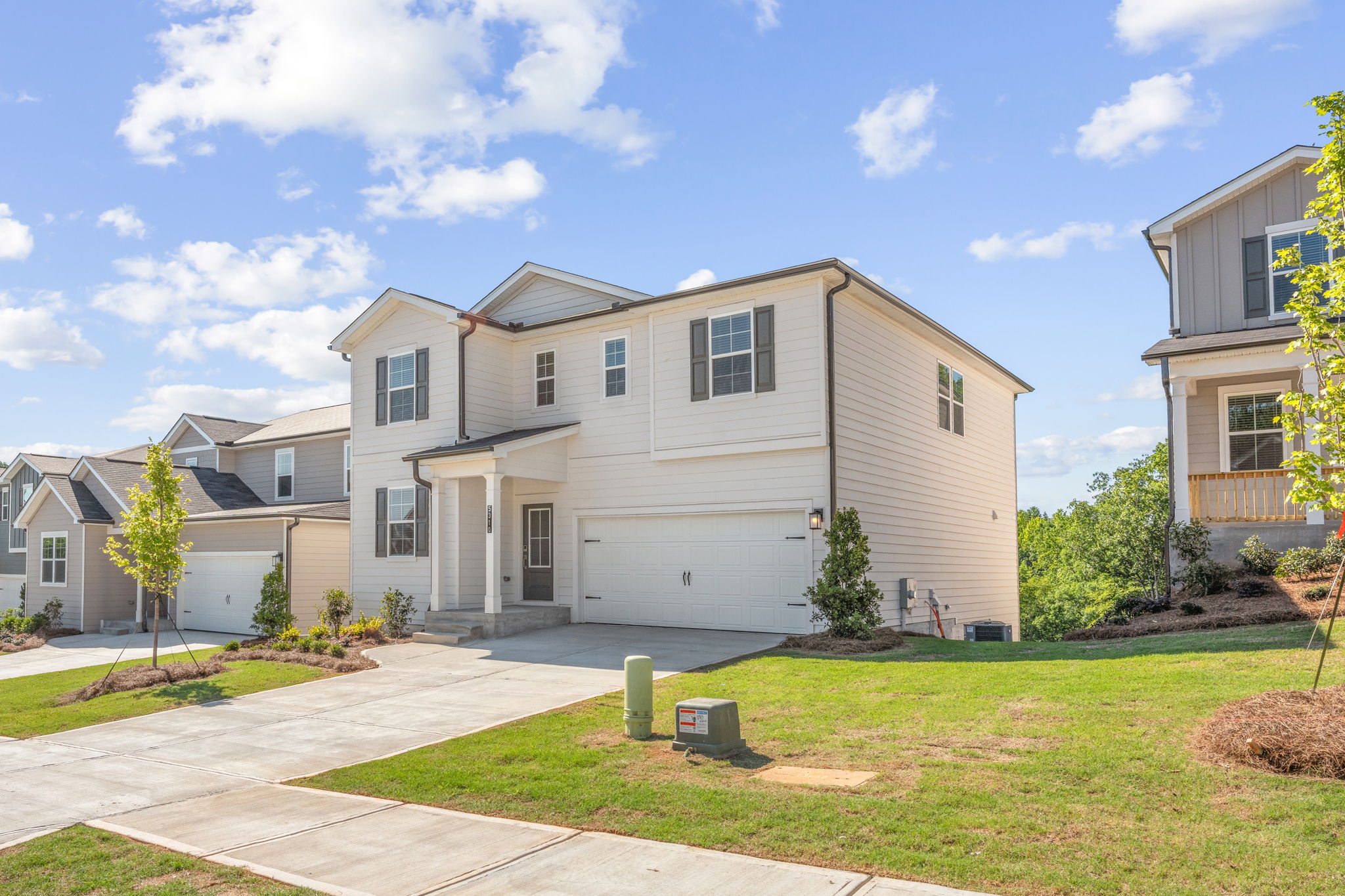 A large house with a lawn.
