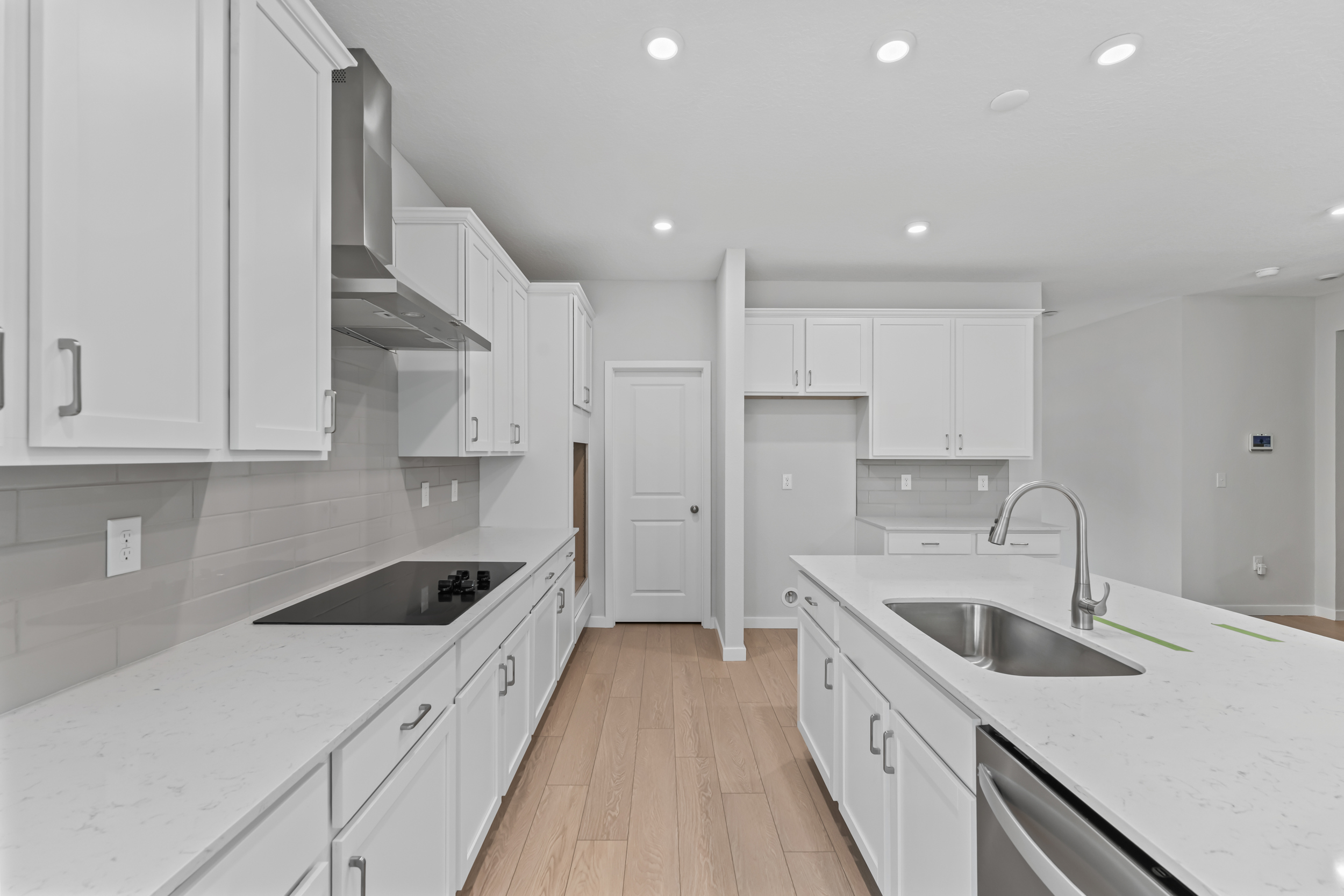 Dogwood Plan Lot 582 Chef's Kitchen with White Cabinets at NorthShore in Kingsland