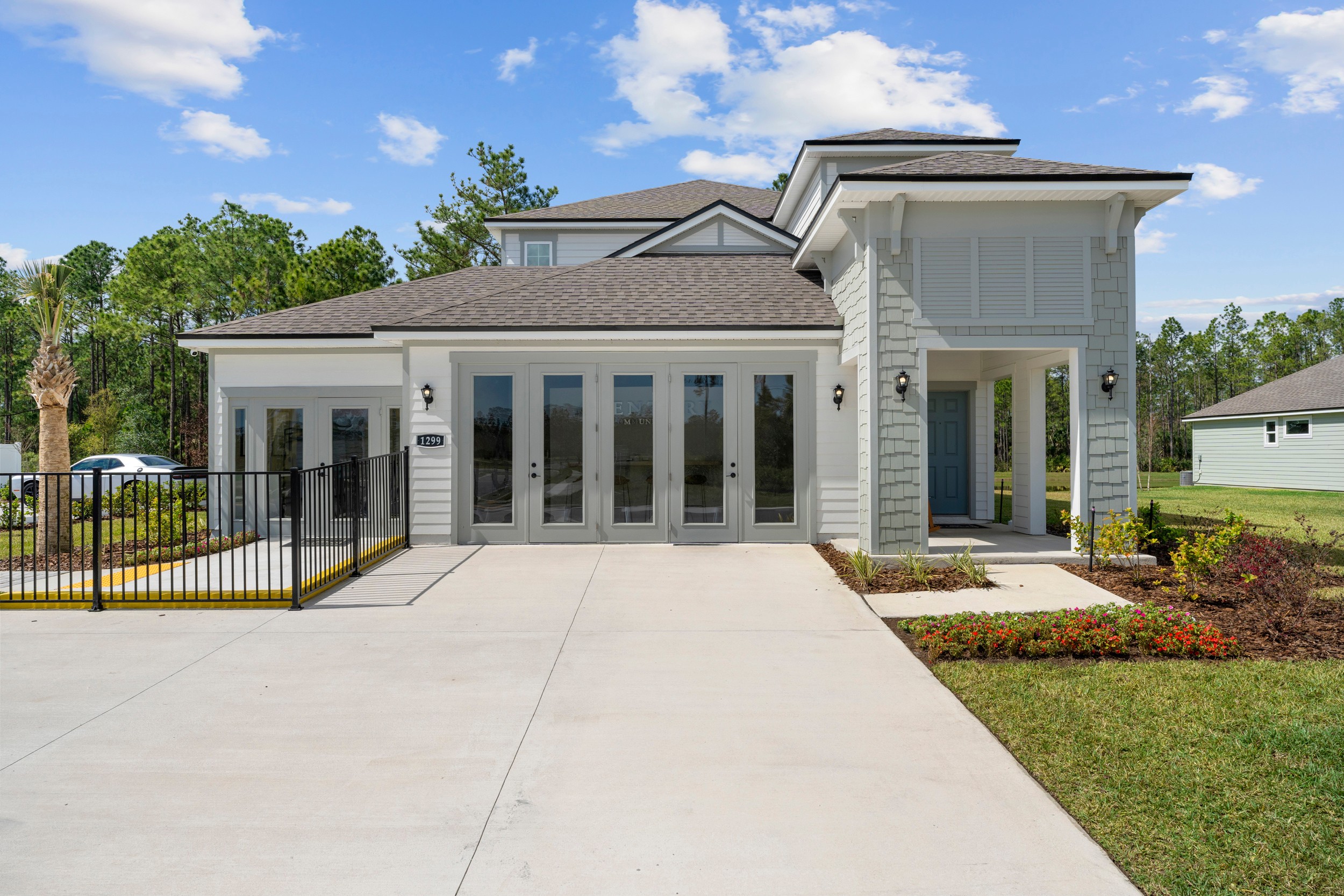 A white house with a driveway.