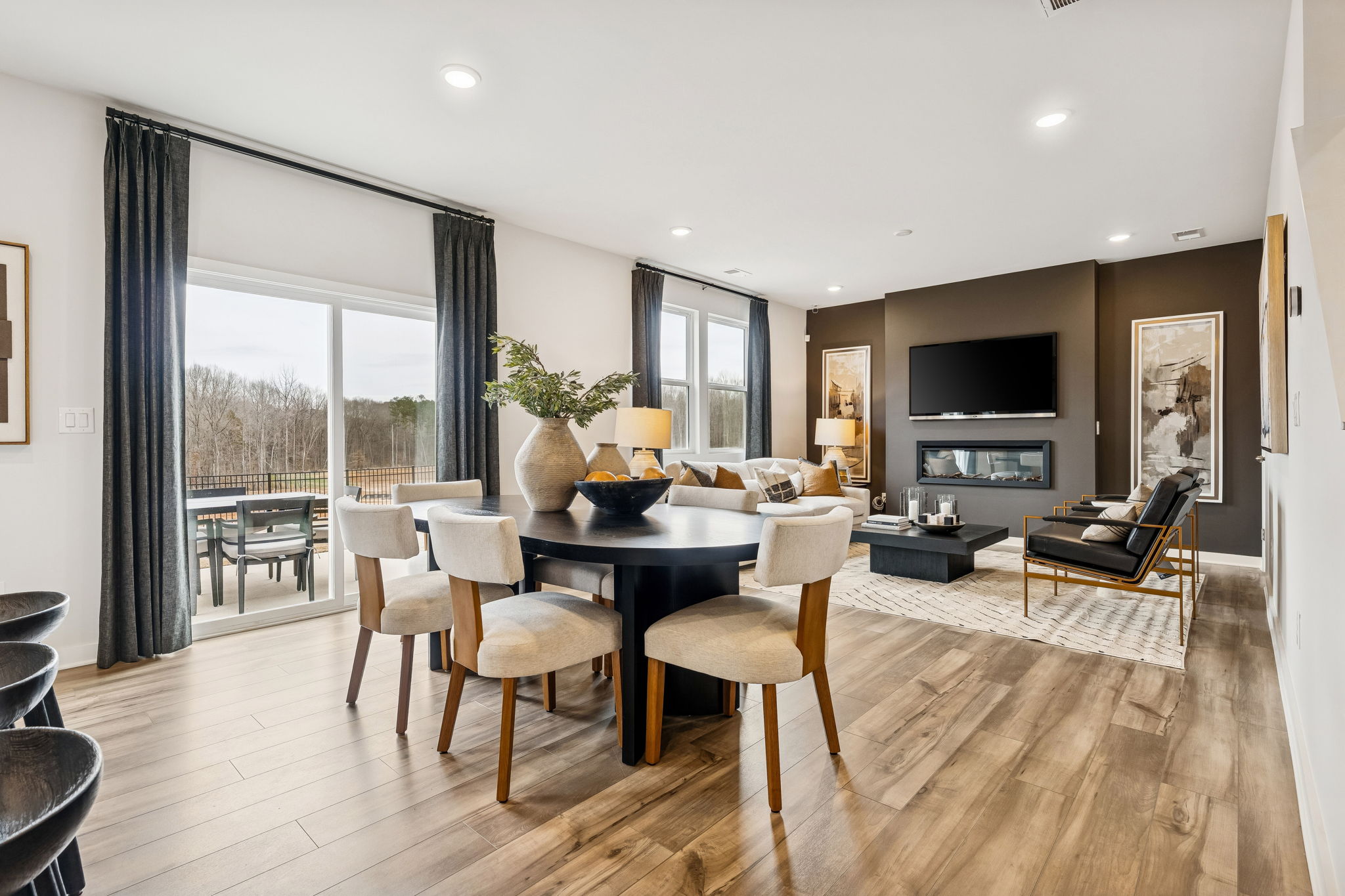 A large living room with a large window.