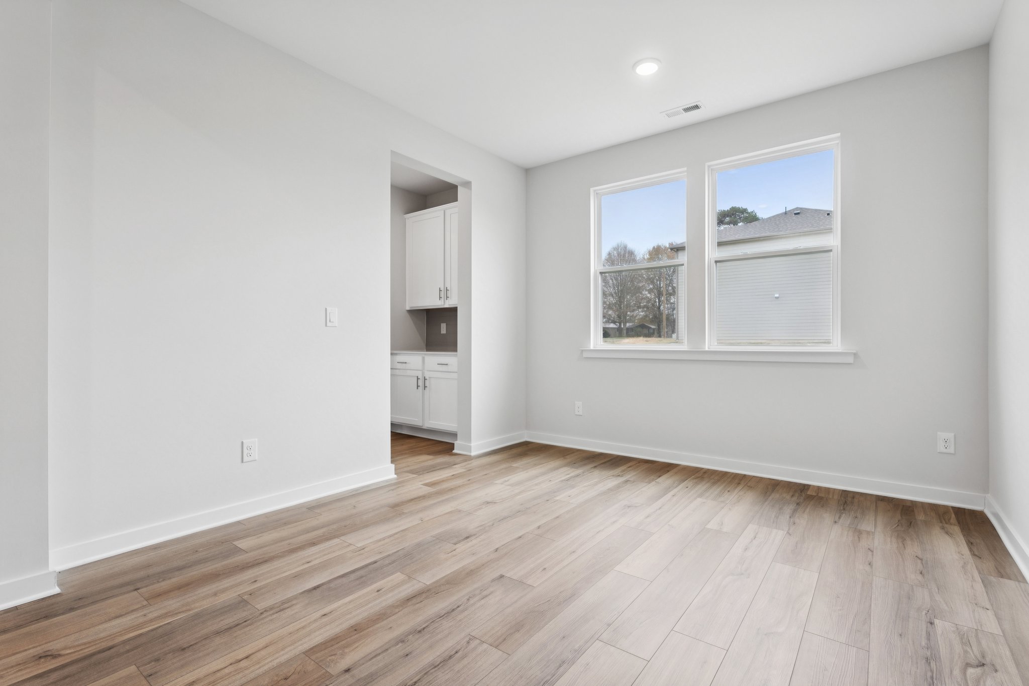 A room with a wood floor and a wood floor.