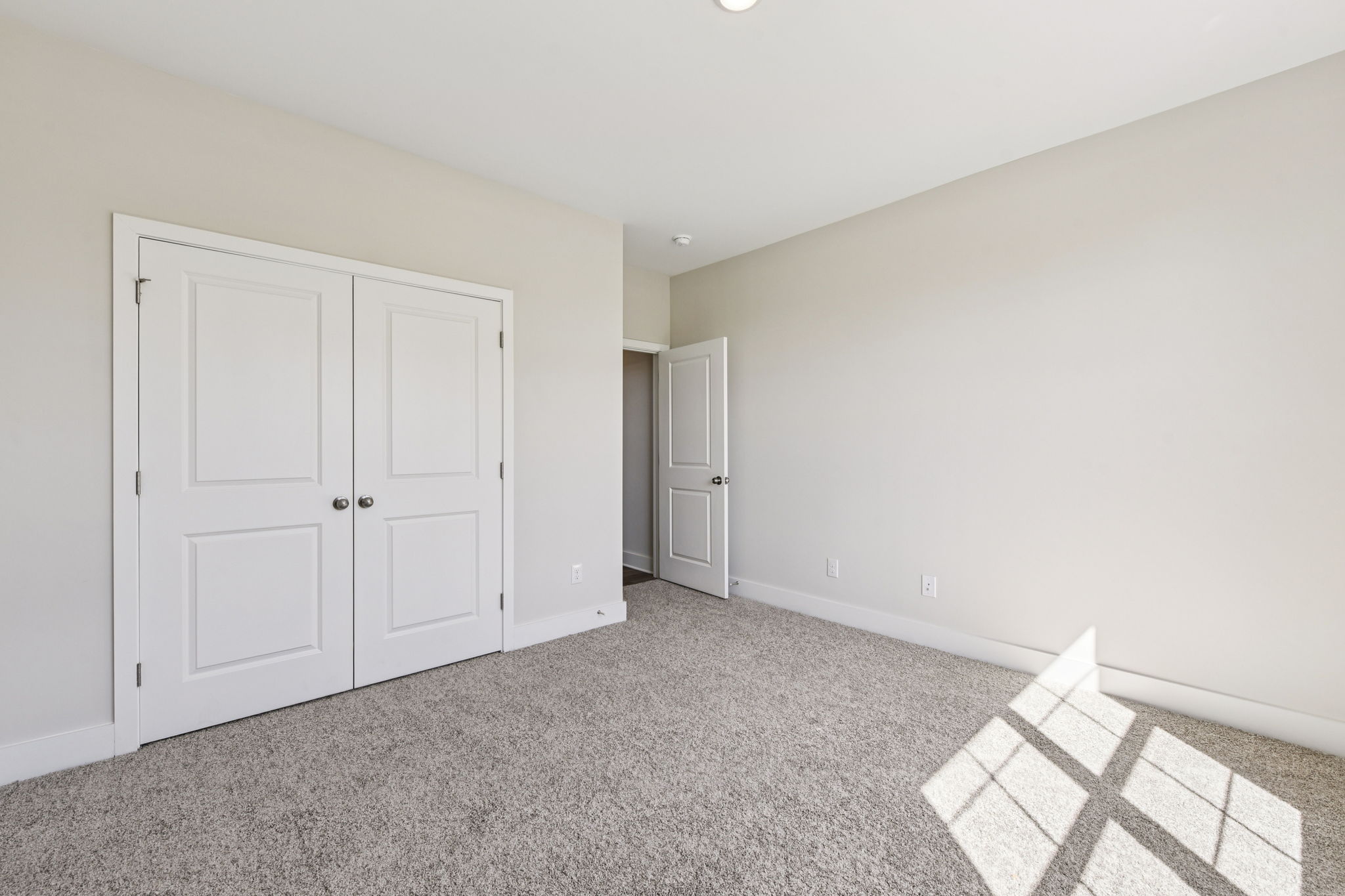 A room with white doors.
