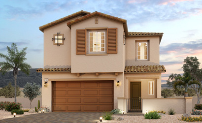 A house with a garage and trees.