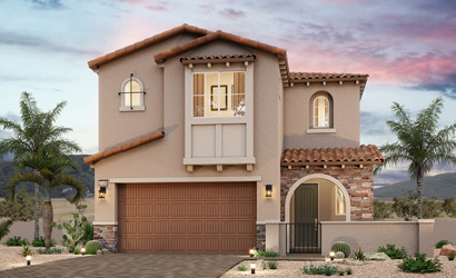 A house with a garage and a brick driveway.