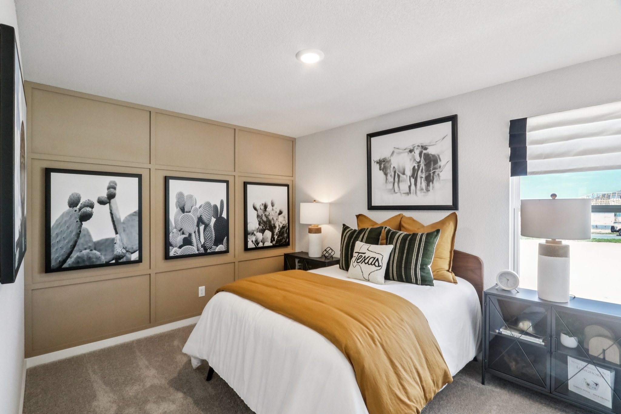 A bedroom with a bed and a window.