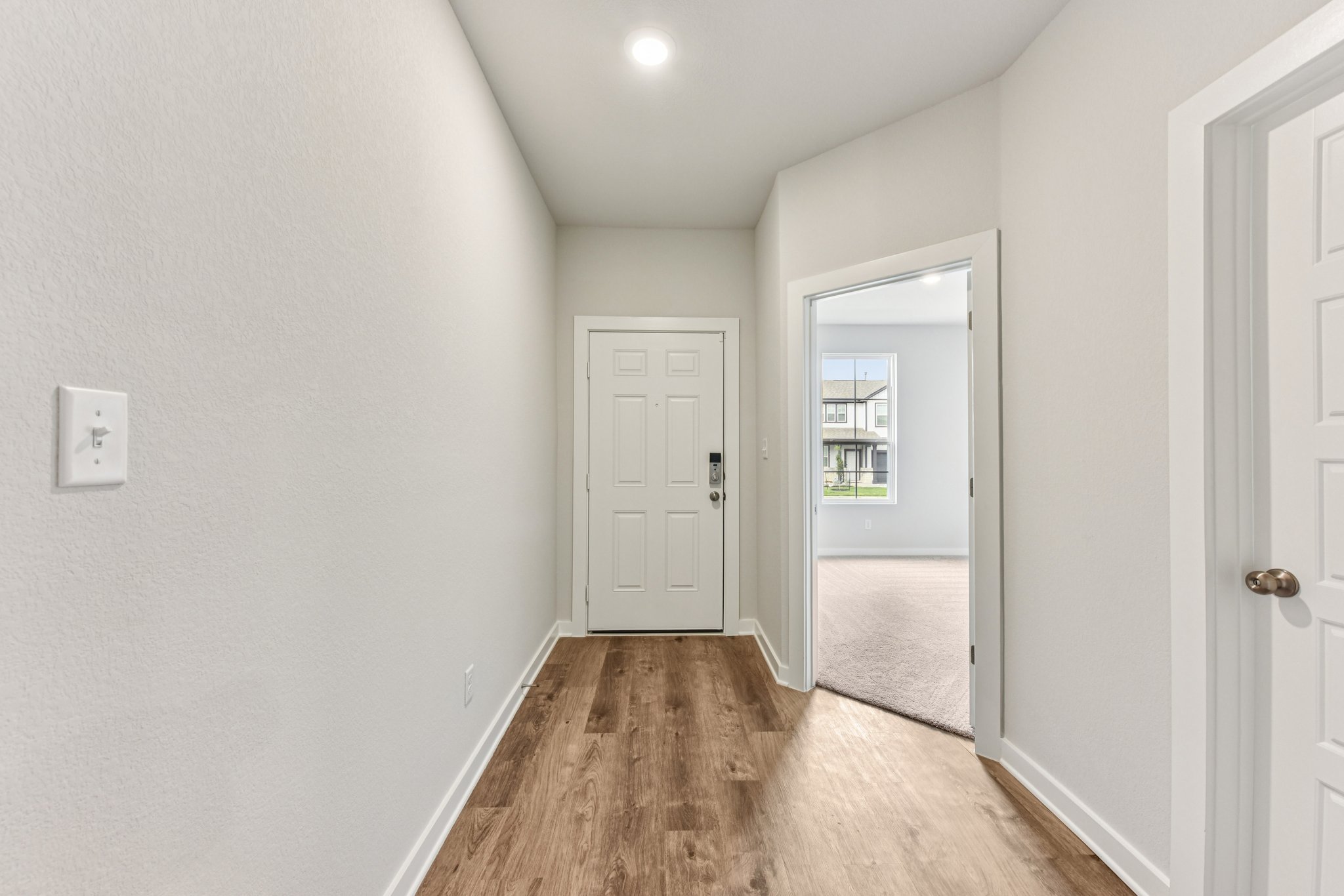 A hallway with white doors.