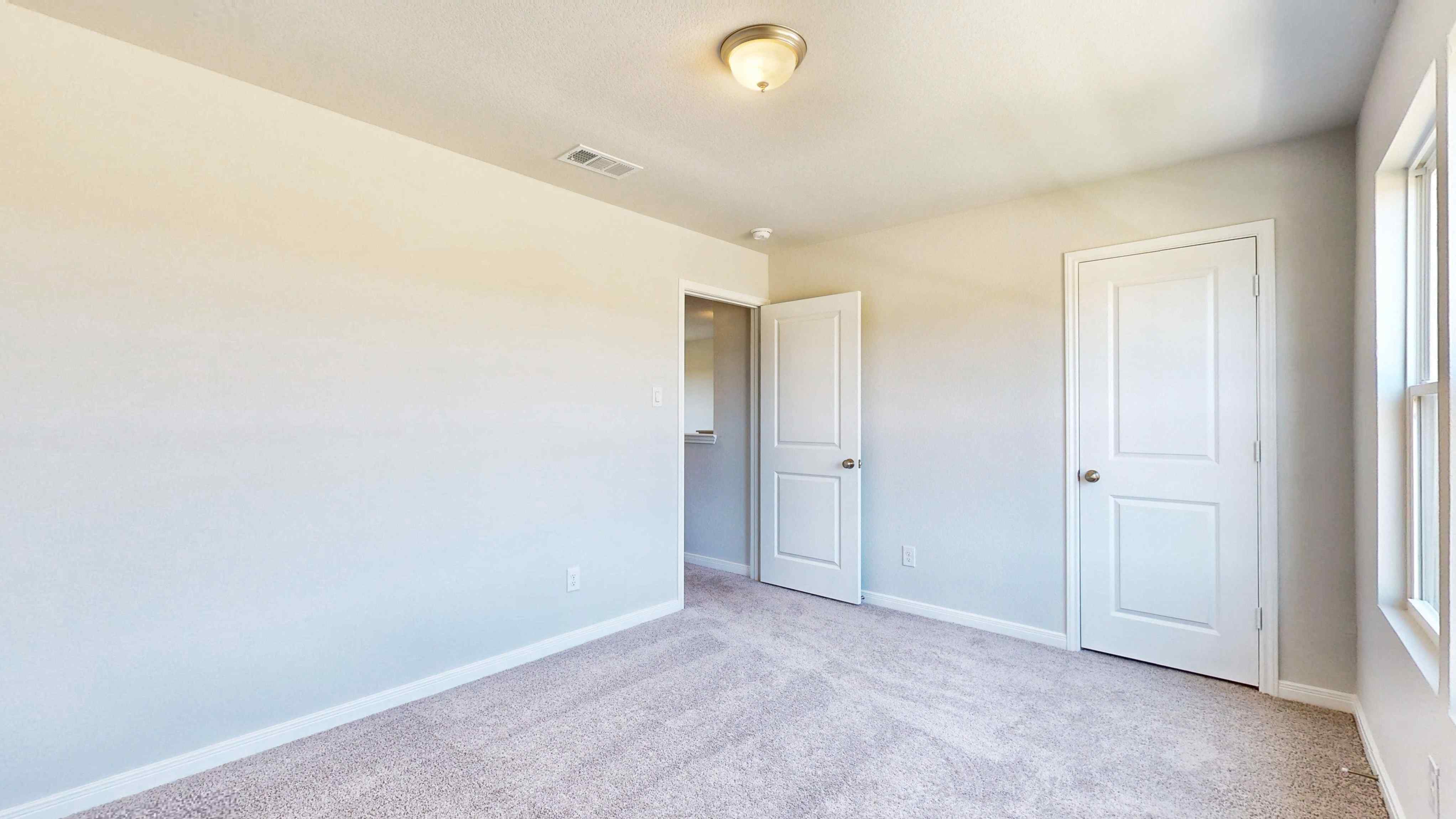 A room with white doors.