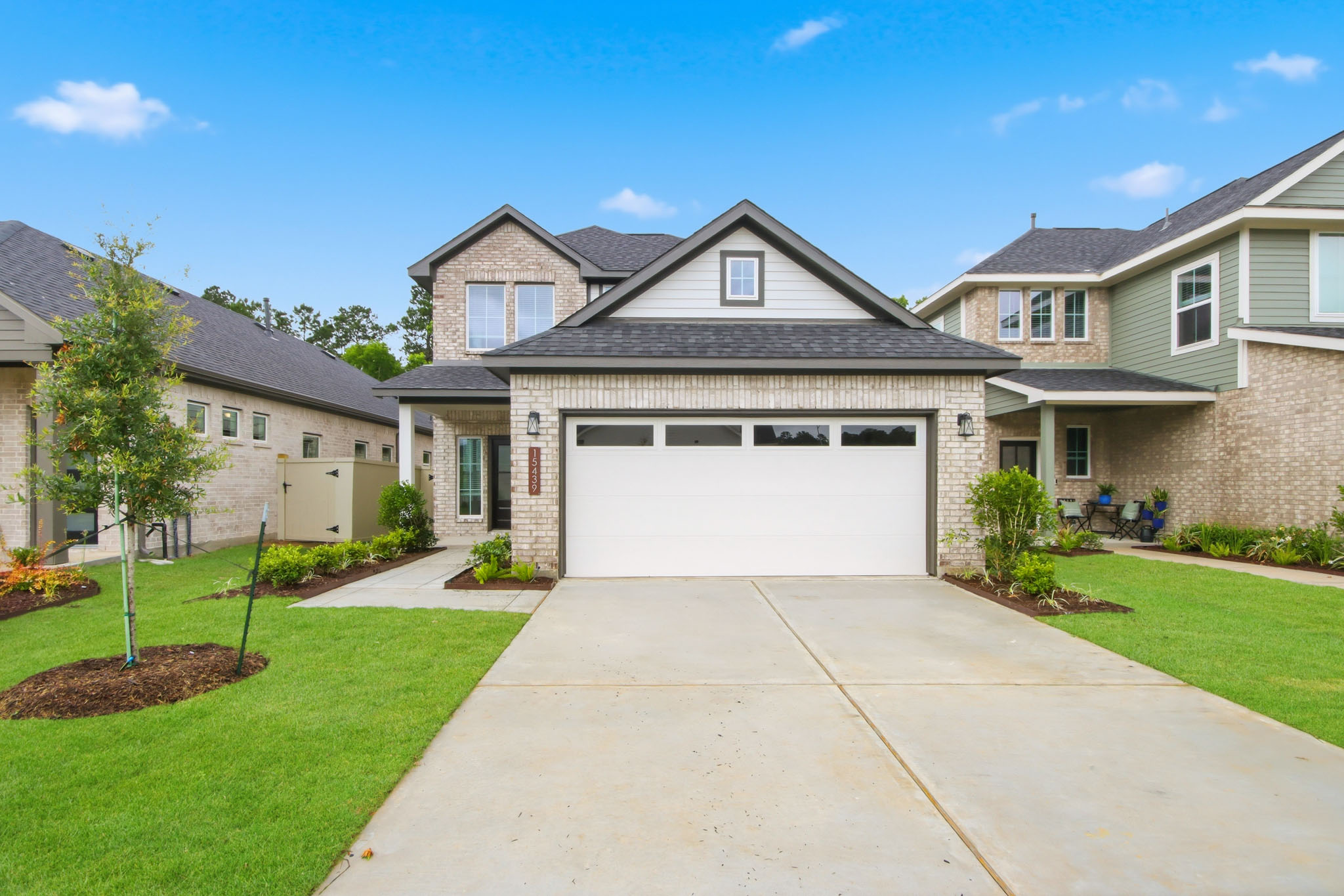 A driveway leading to a house.