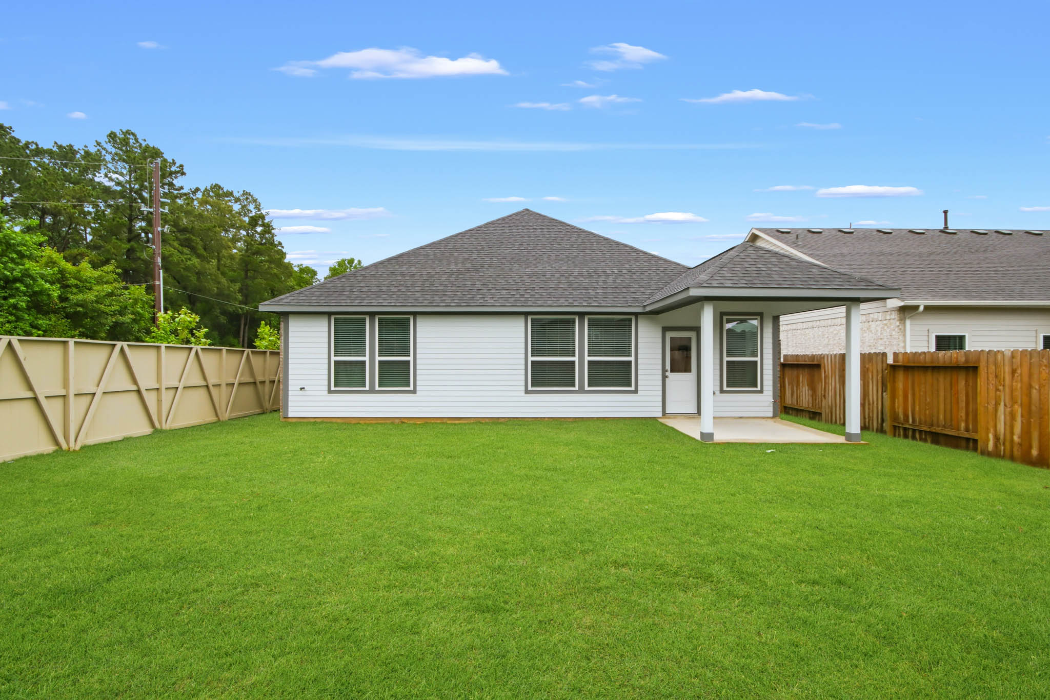 A house with a green lawn.