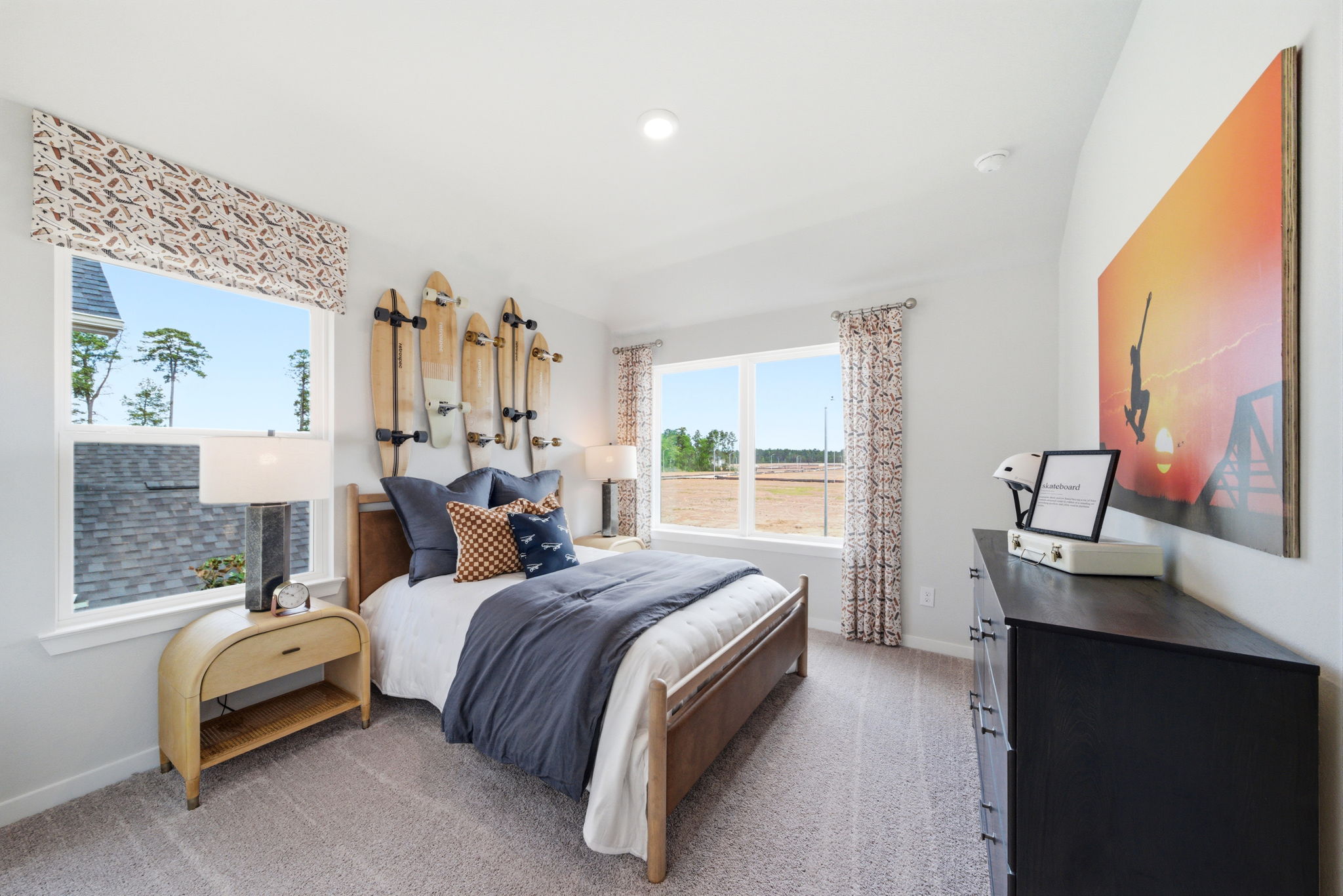 A bedroom with a large window.