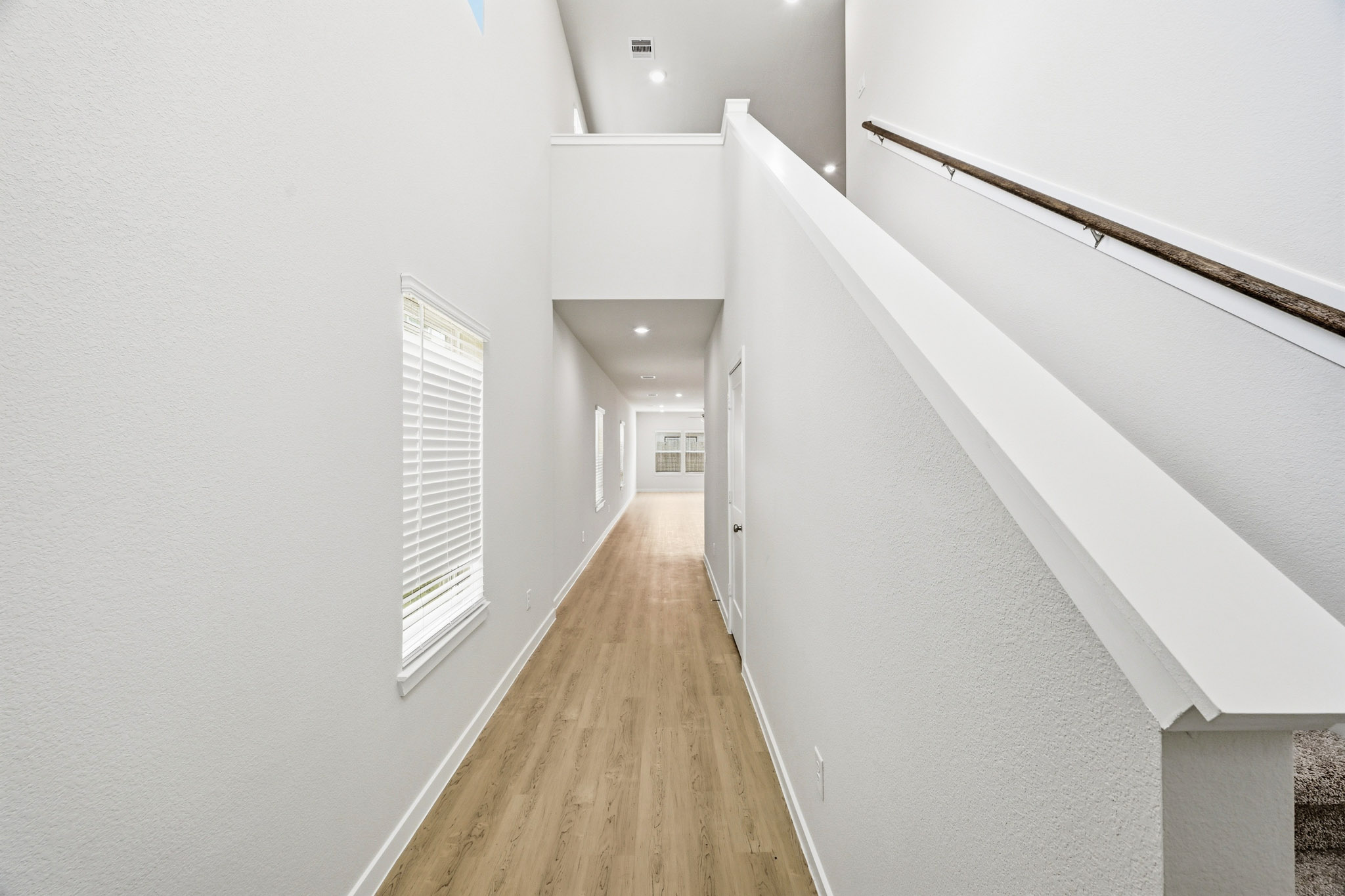 A hallway with white walls.