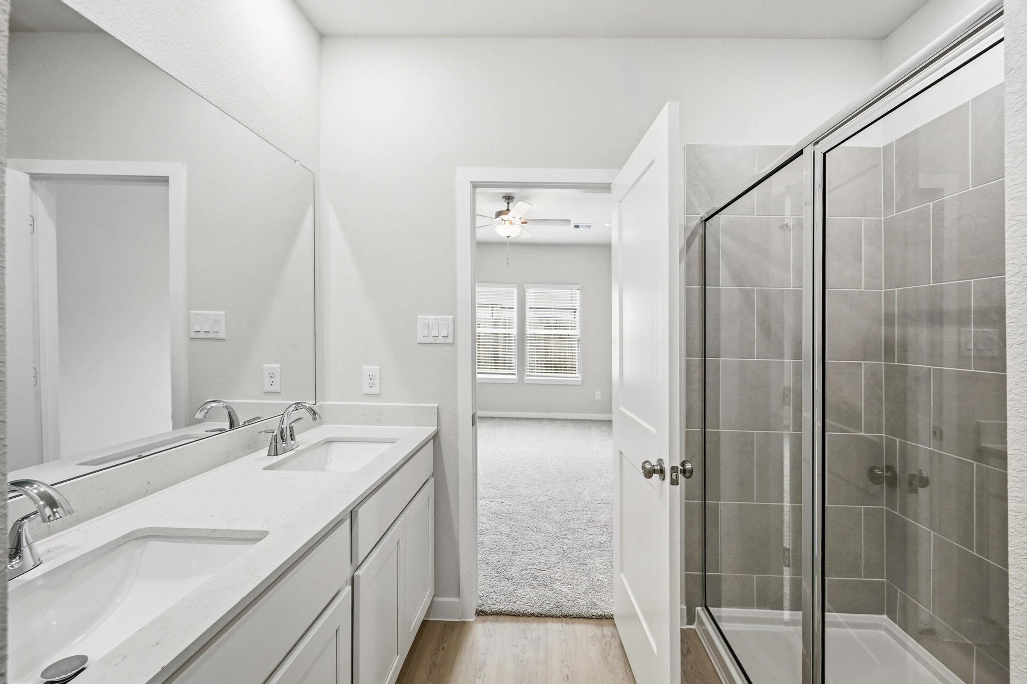 A bathroom with a glass shower.