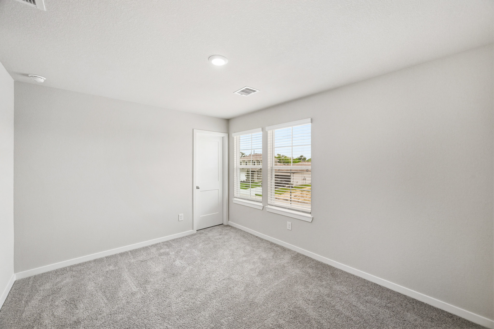 A room with a door and a window.