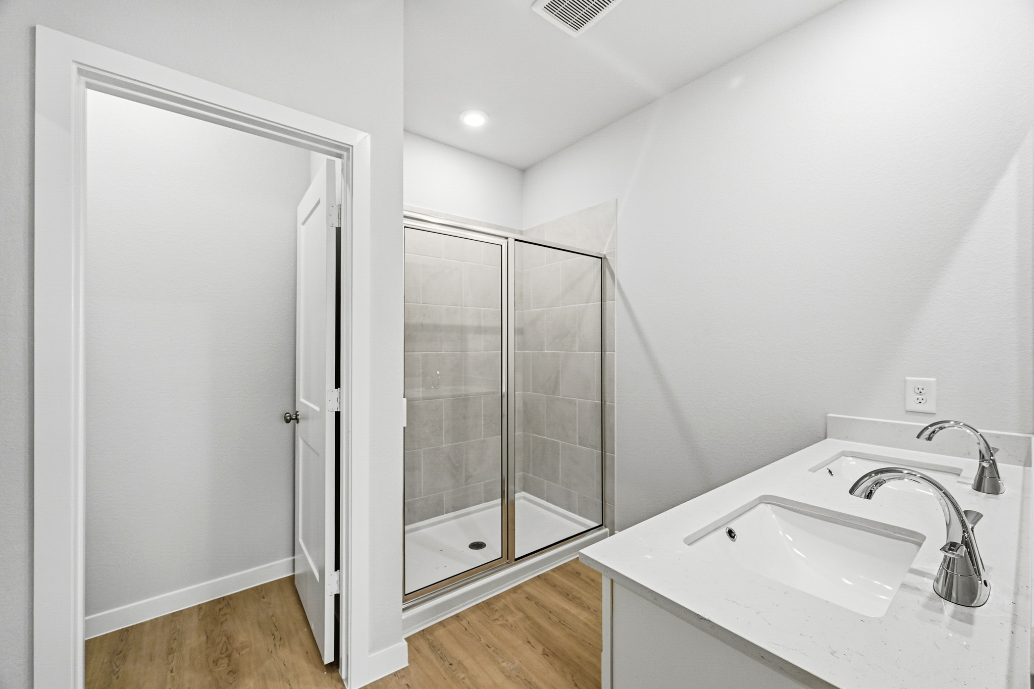 A bathroom with a glass shower.