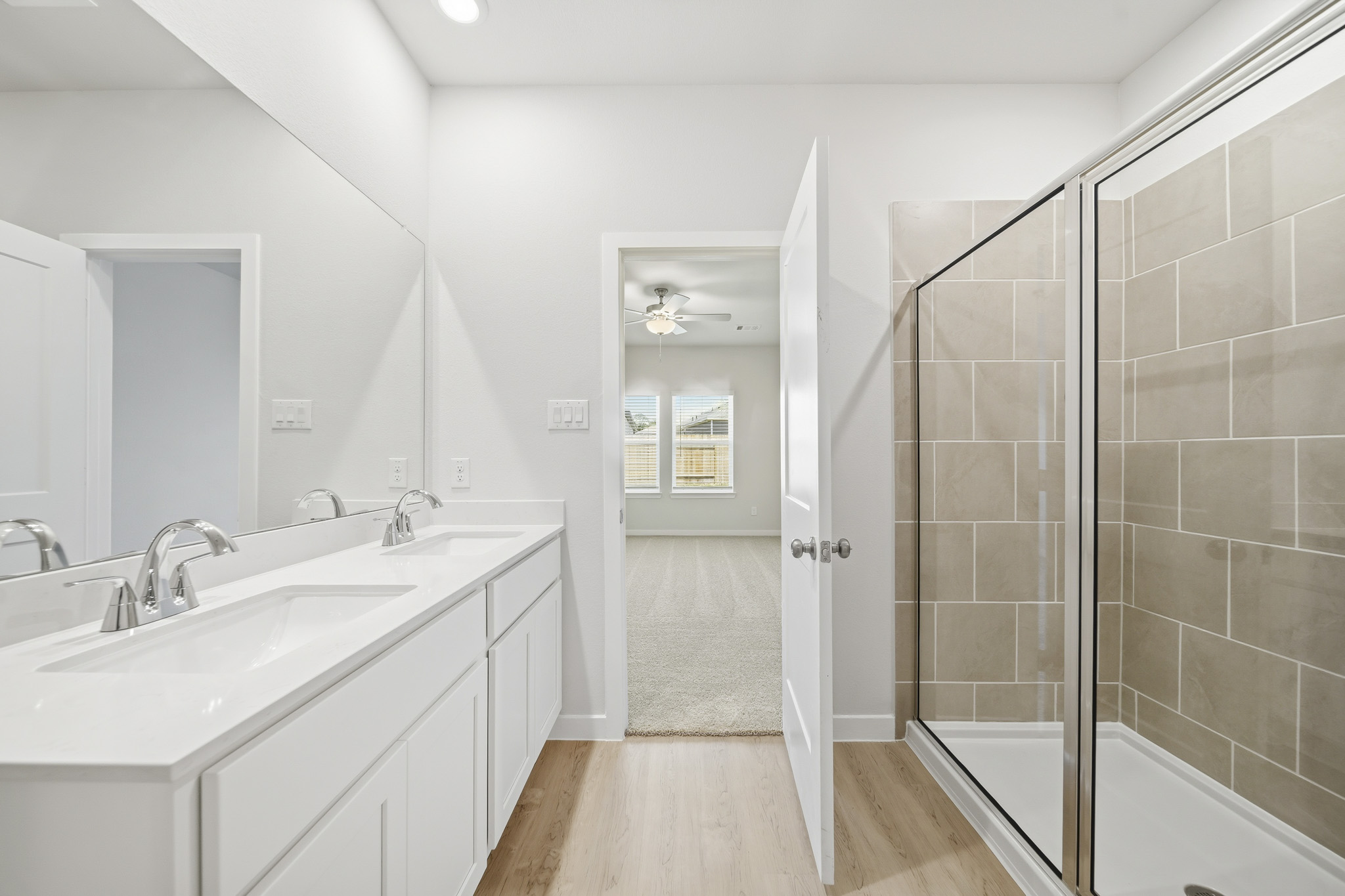 A bathroom with a glass shower.