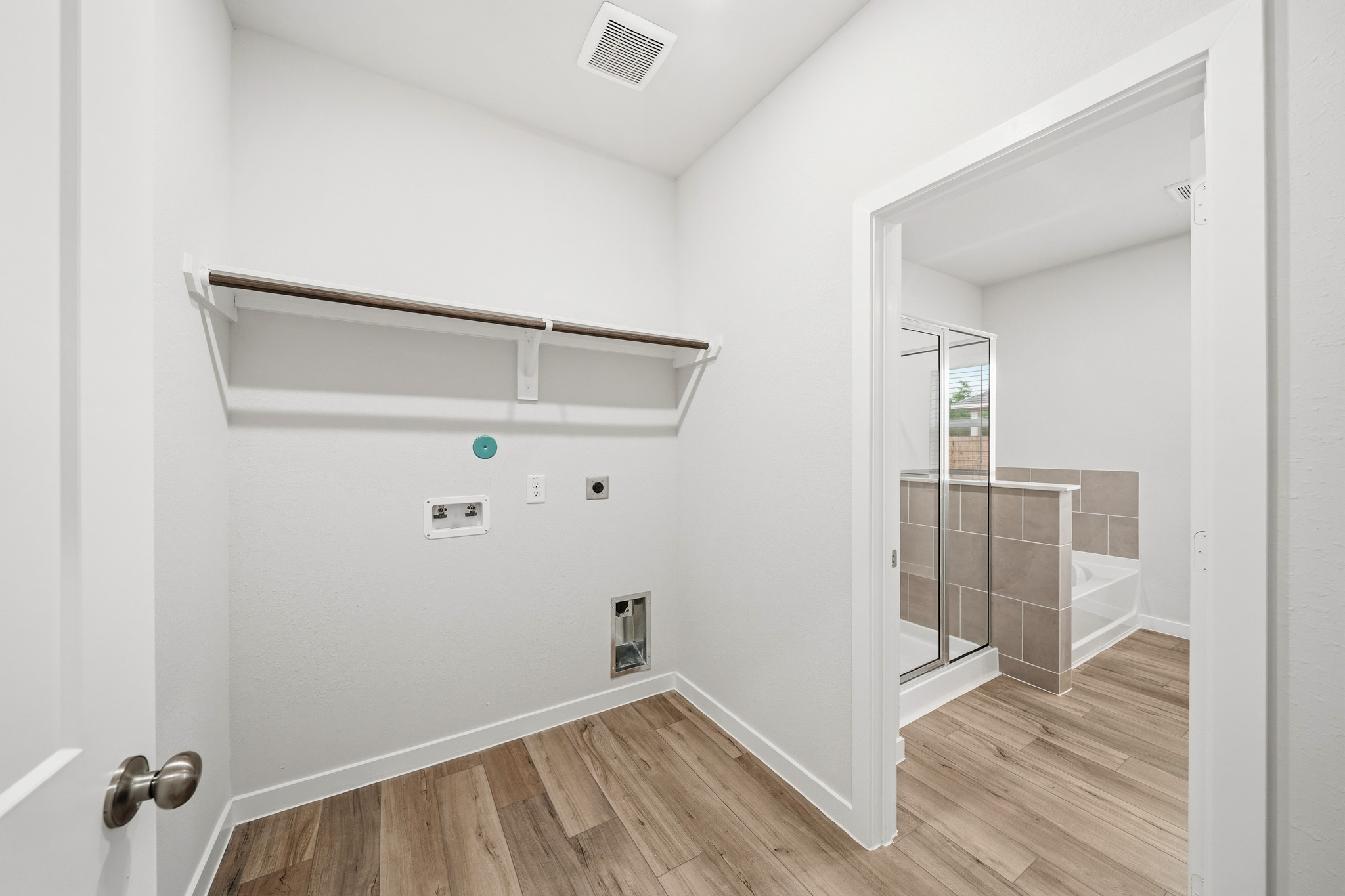 A bathroom with a glass shower.