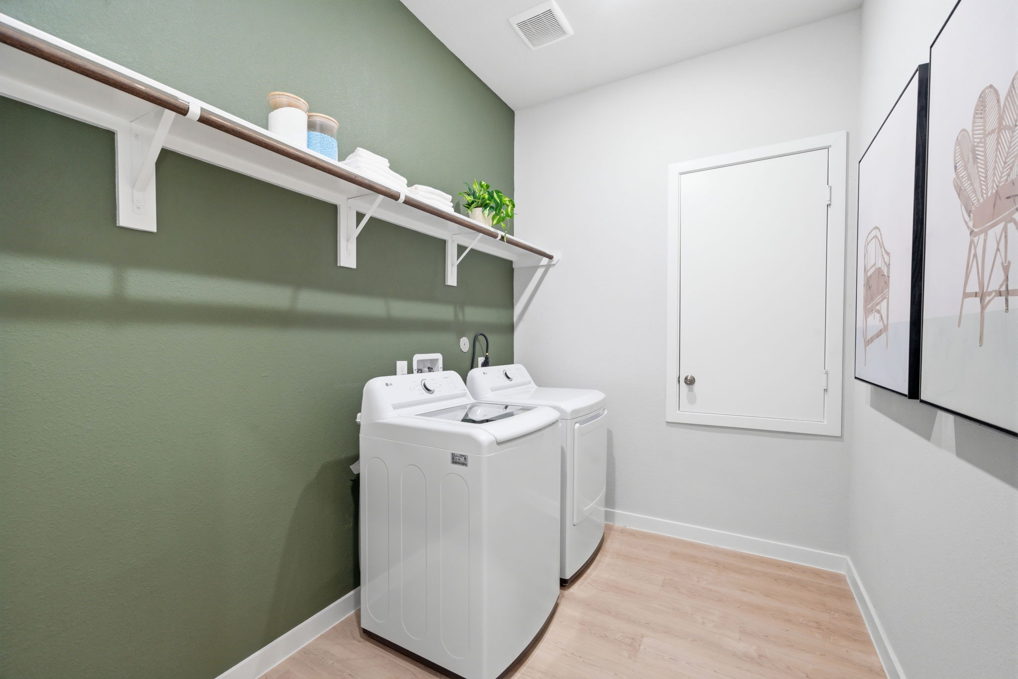A washer and dryer in a room.