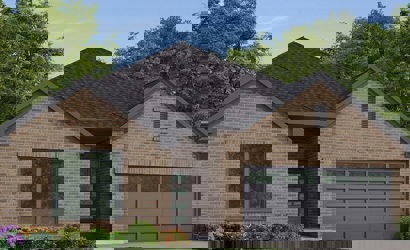 A brick house with a driveway.
