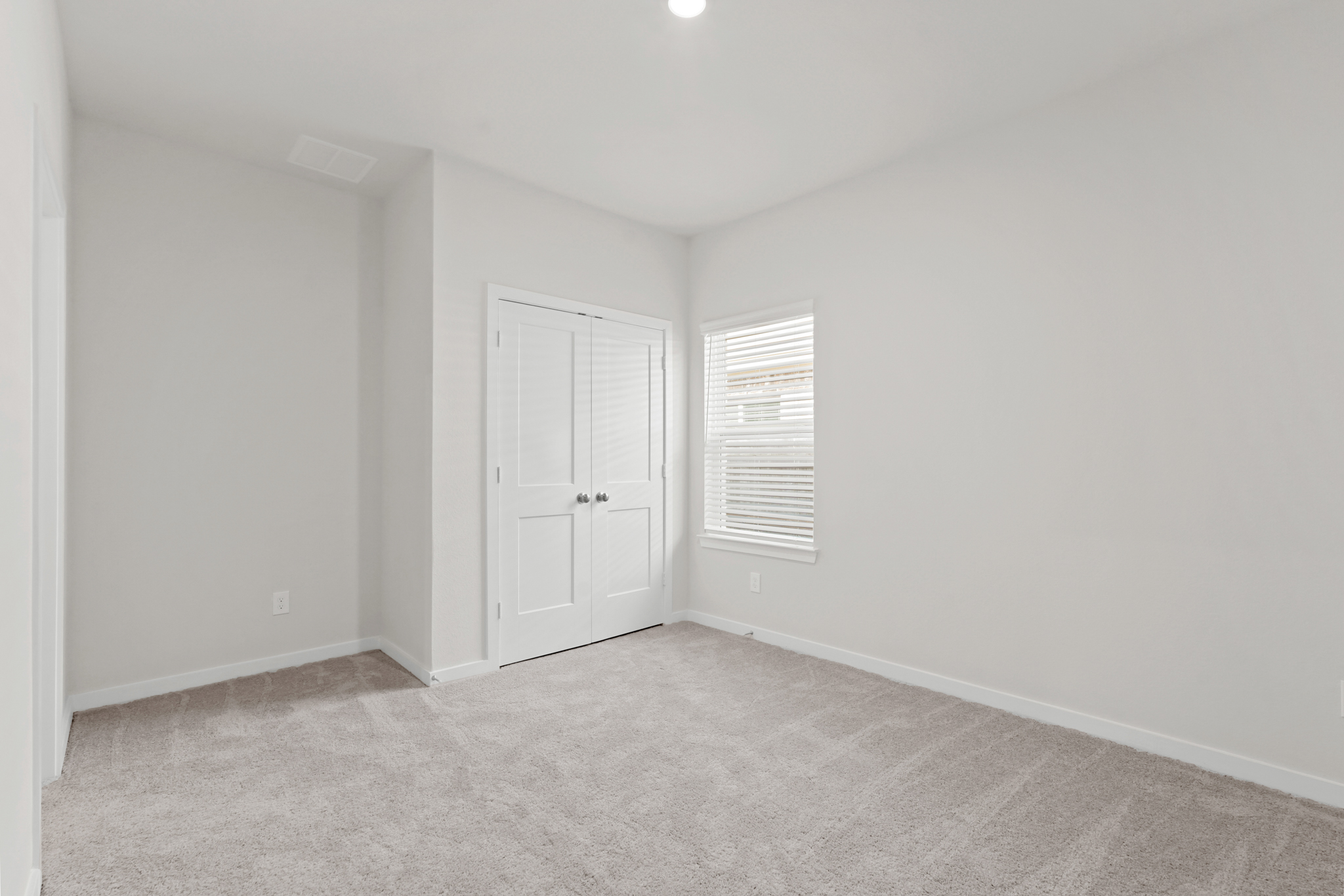 A room with white doors.