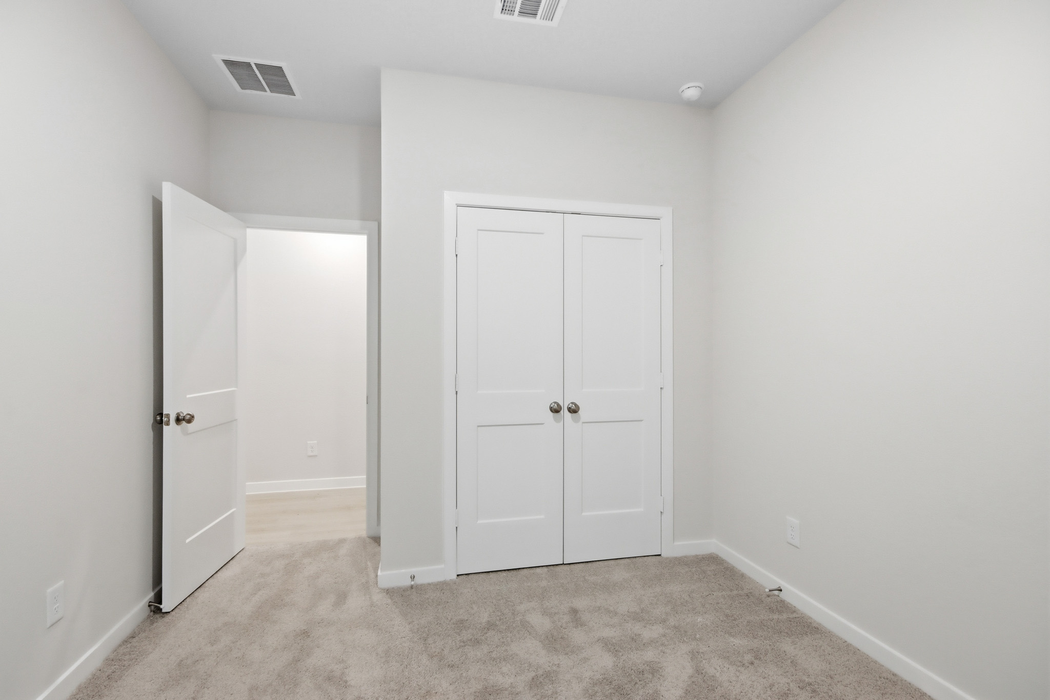 A room with white doors.