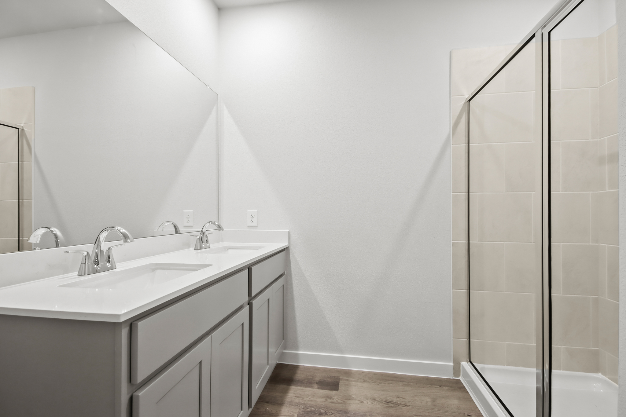A bathroom with a glass shower.