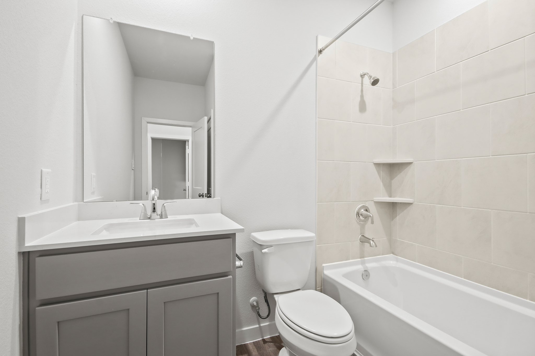 A bathroom with a toilet and sink.