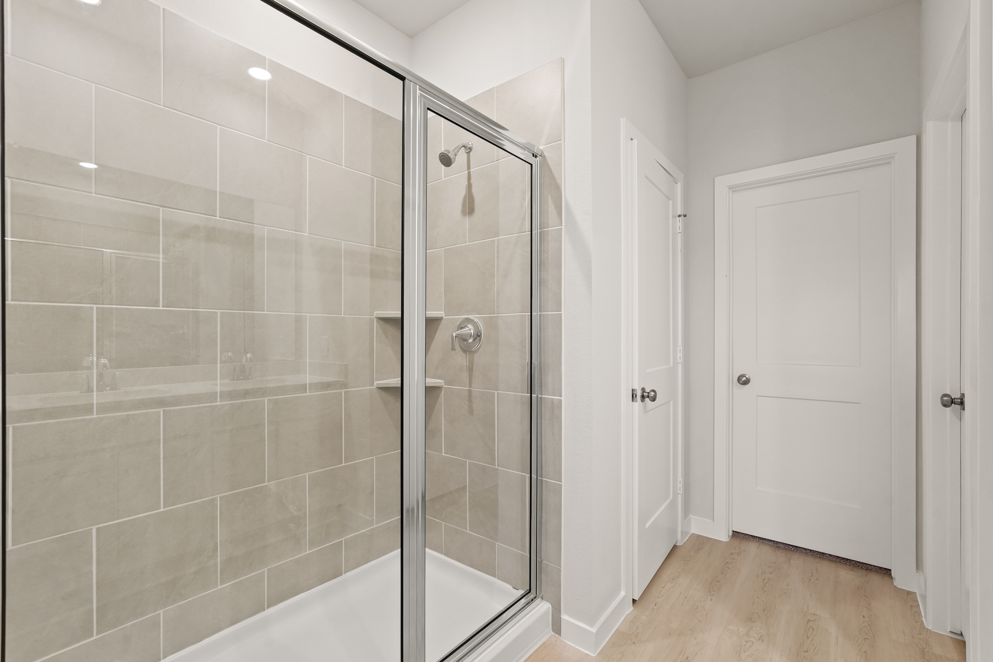 A bathroom with a glass shower.