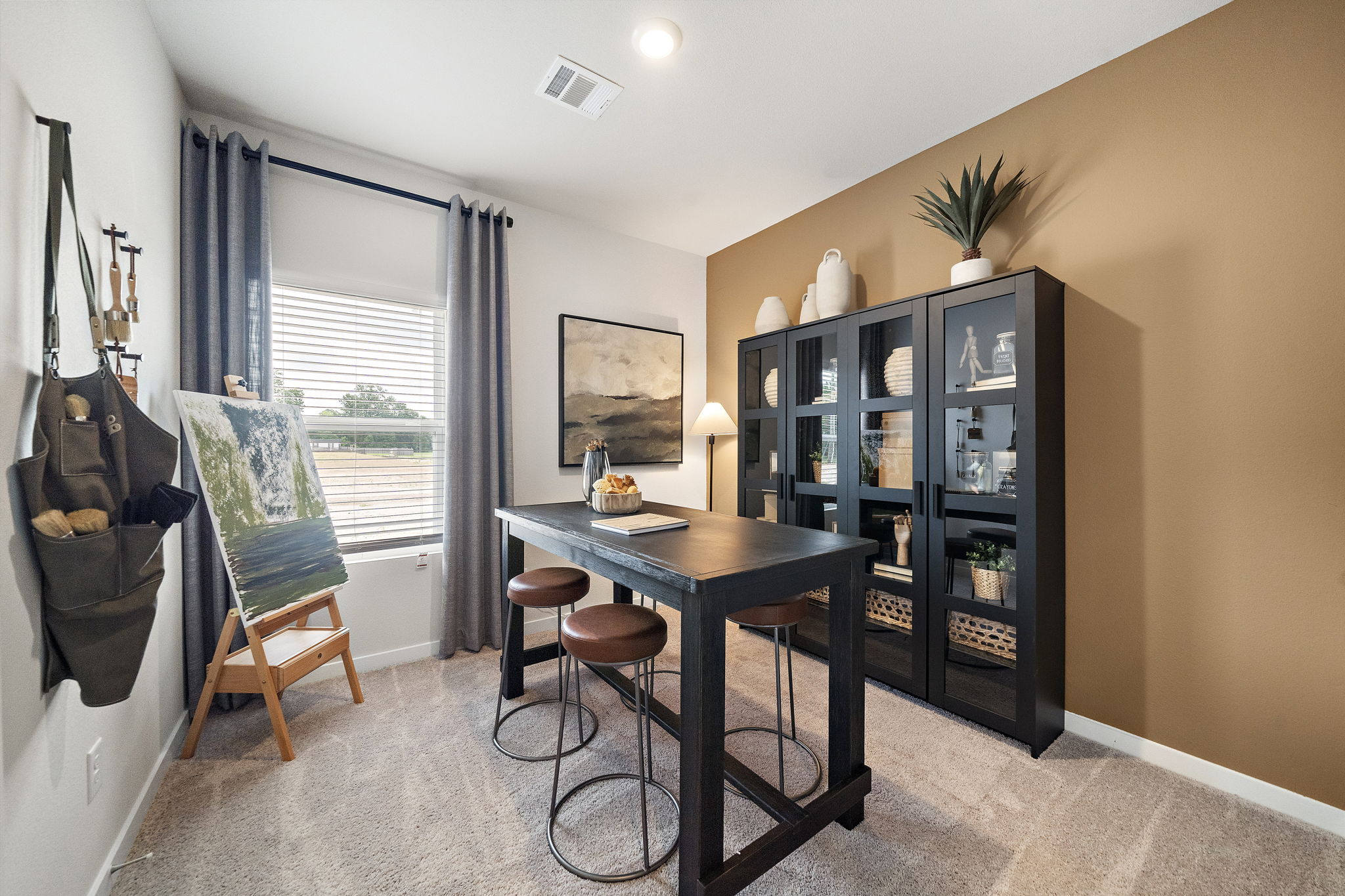 A room with a table and chairs.