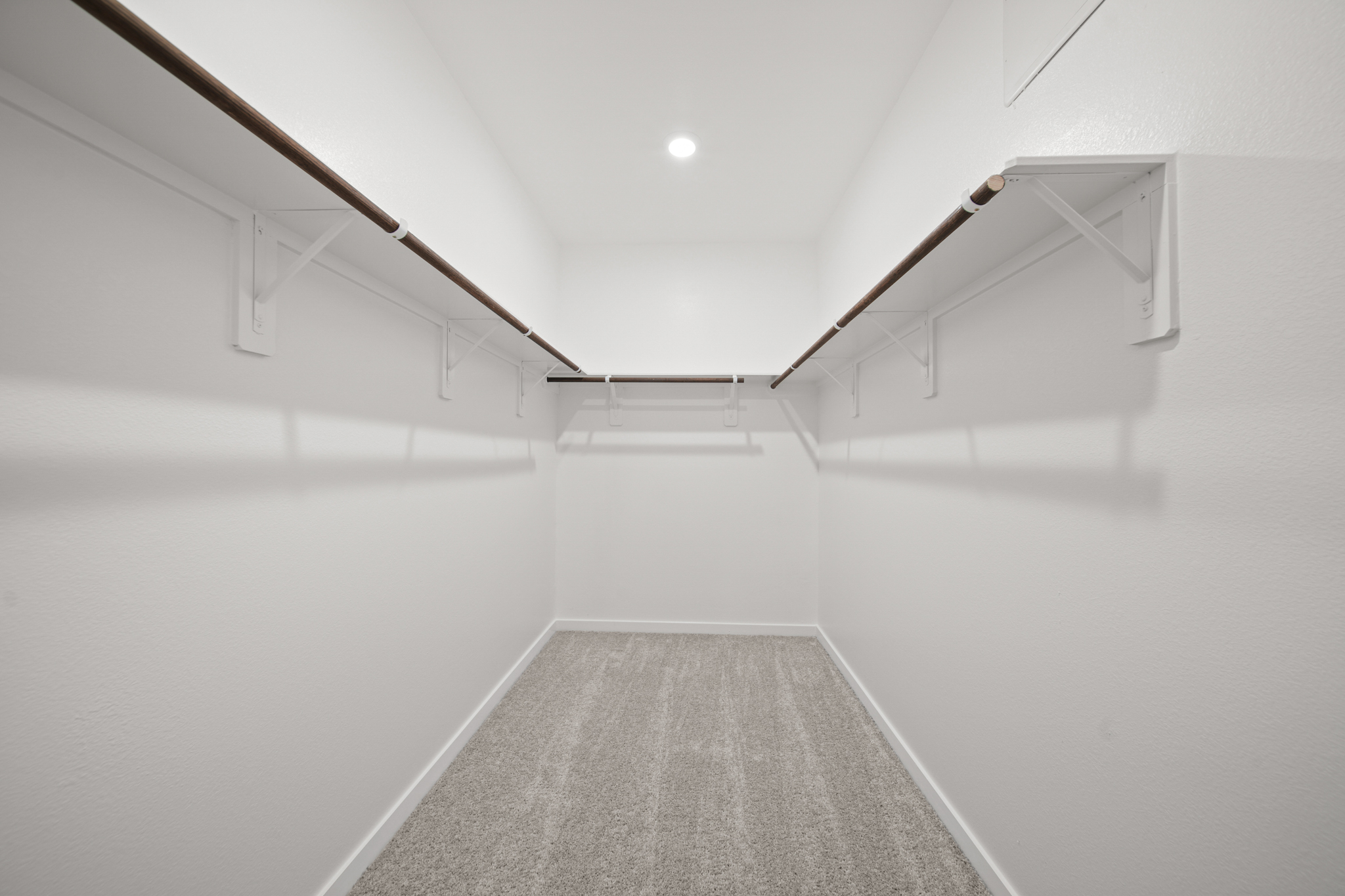 A white hallway with a light.