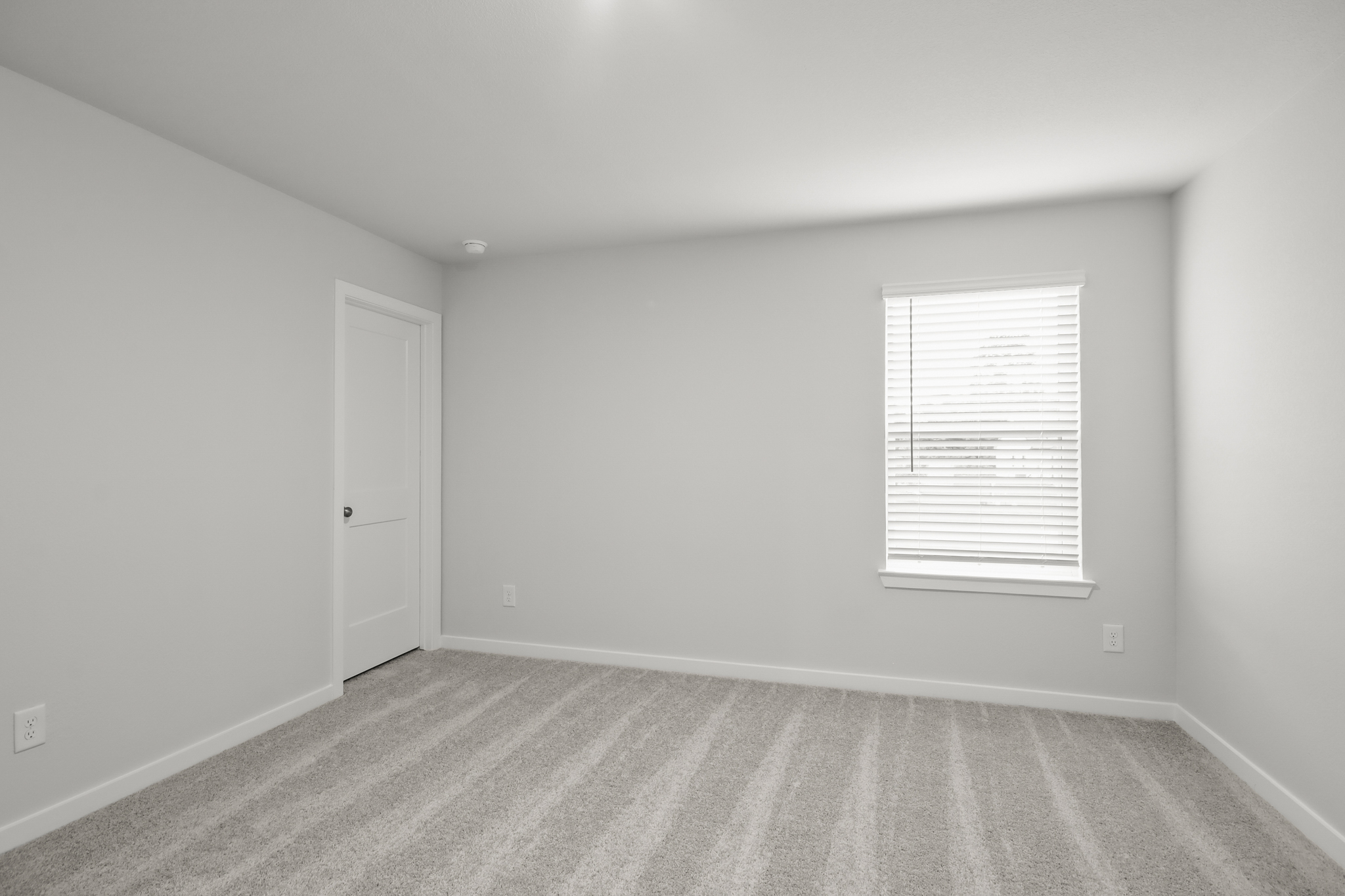 A room with a door and a window.