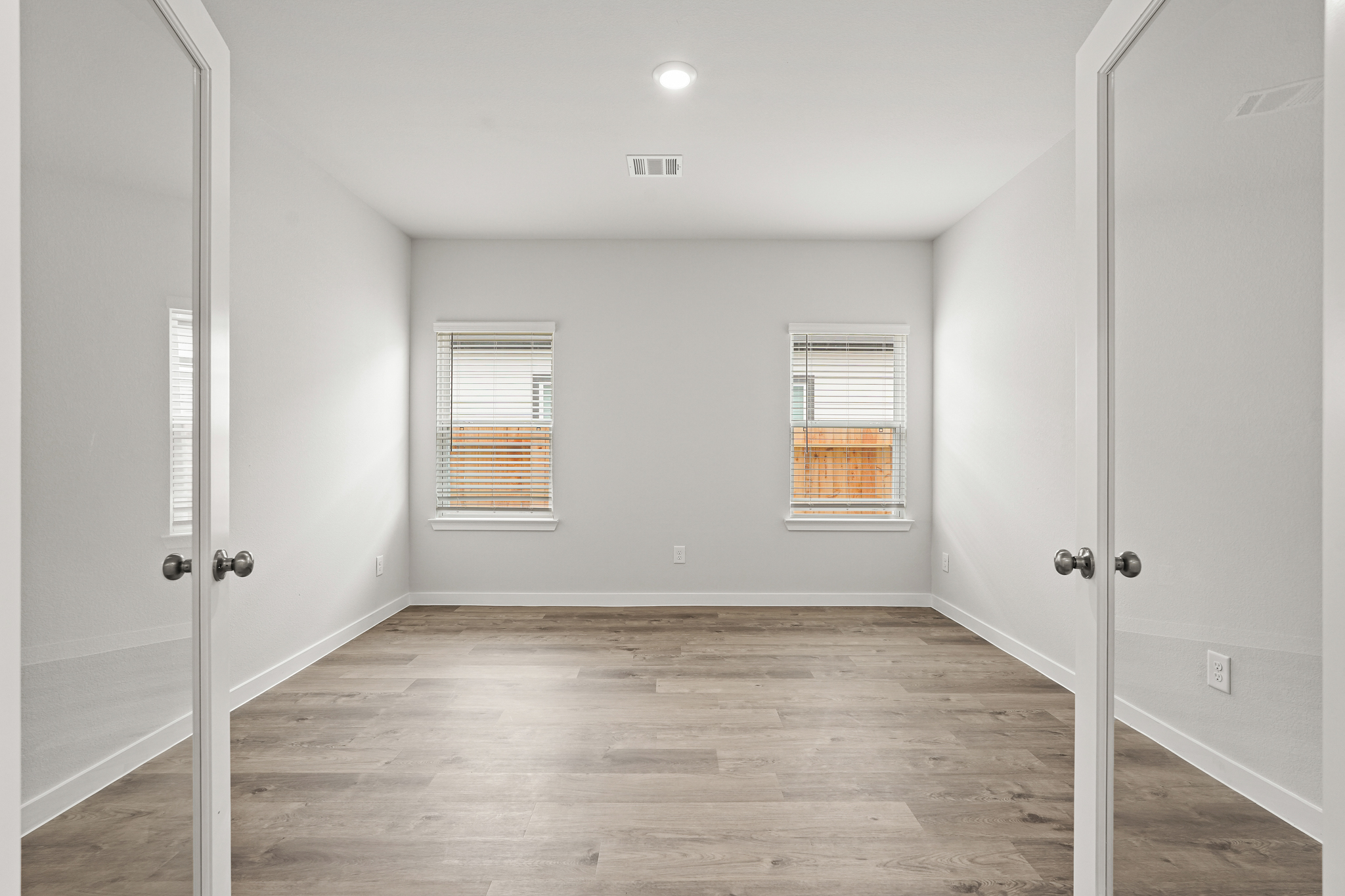 A room with white doors.