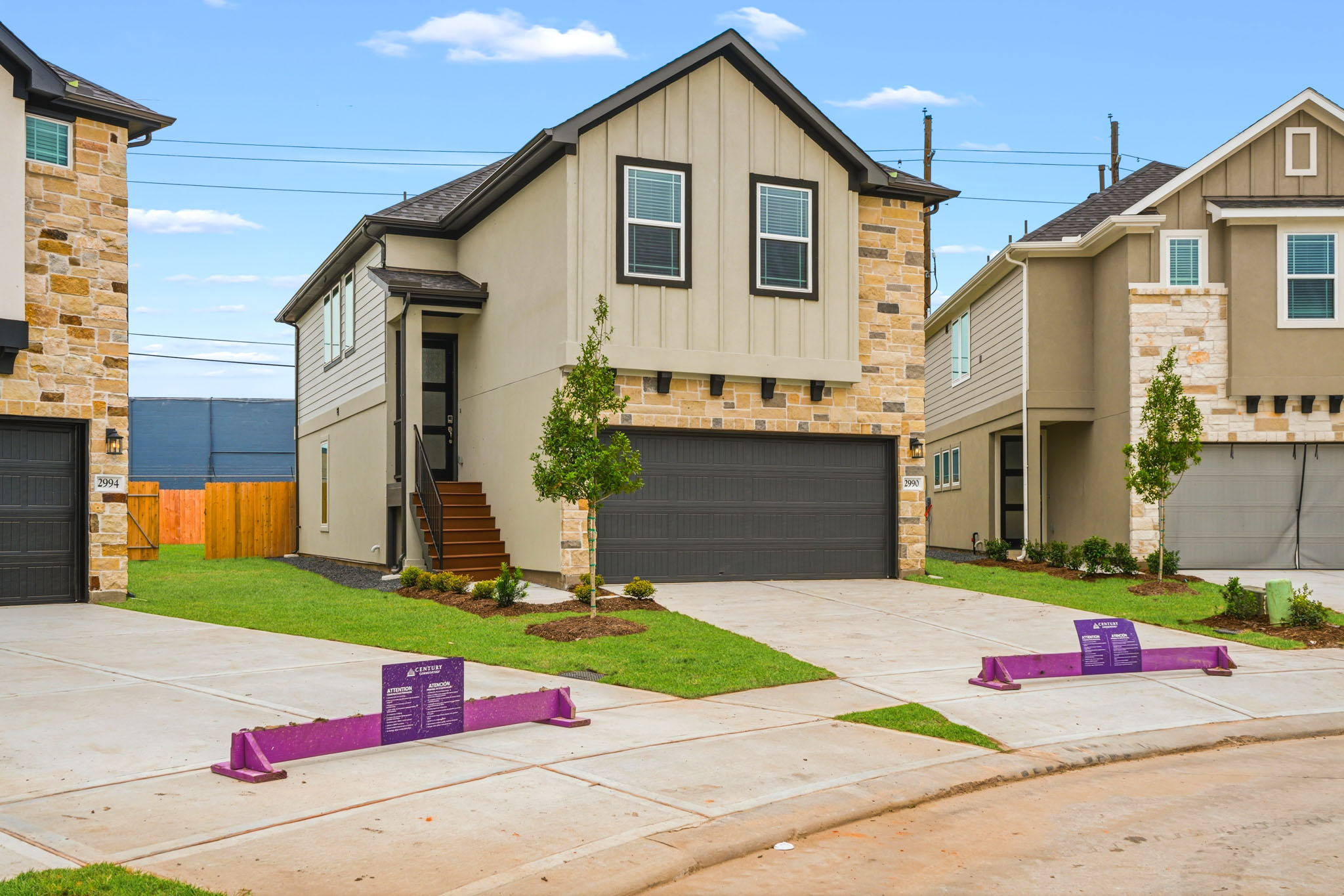 A driveway with a house and a garage.