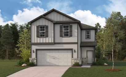 A house with a garage and trees.