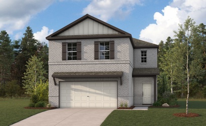 A house with a garage and trees.